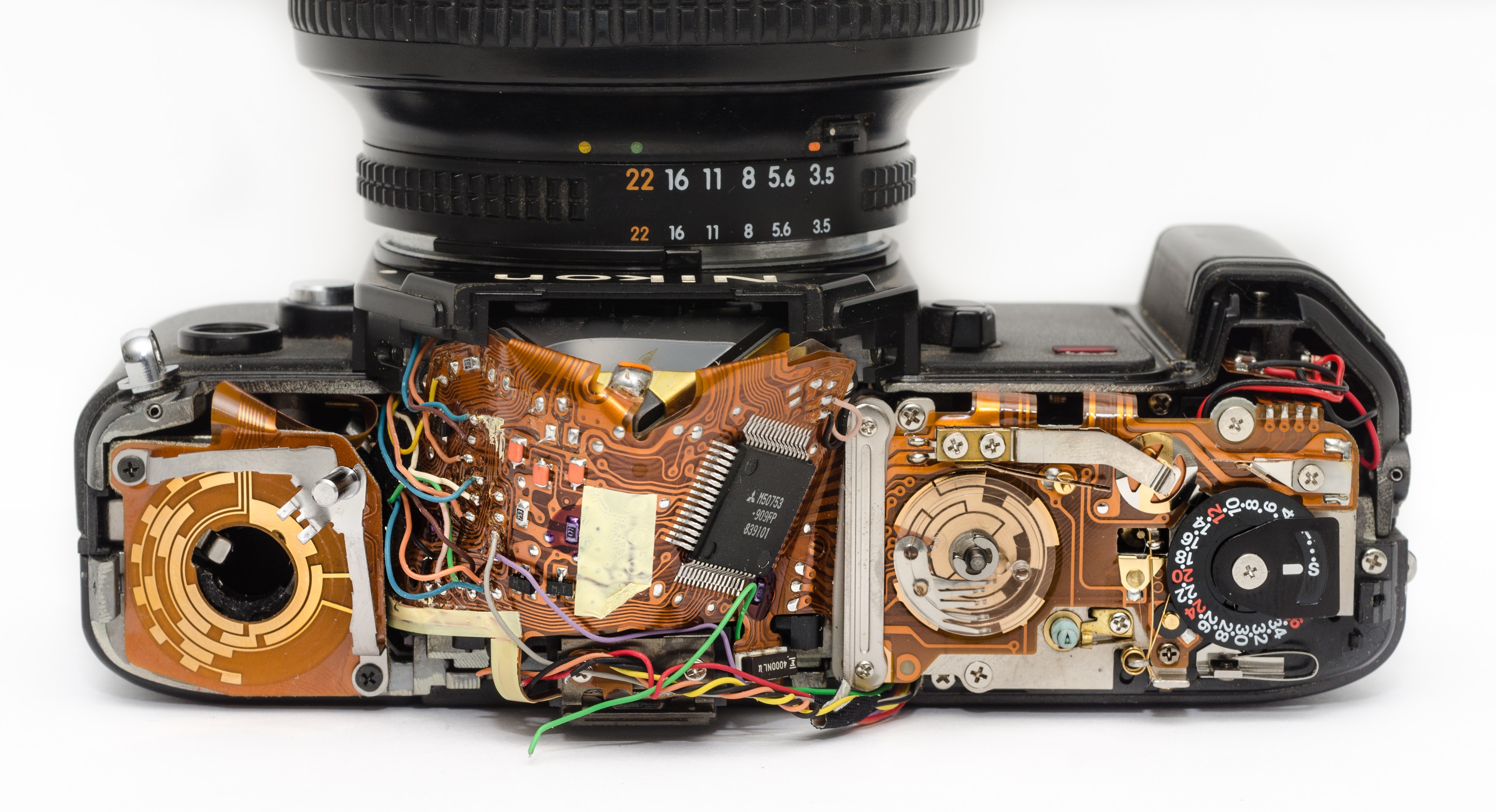 Black dslr camera showing its circuit board photo