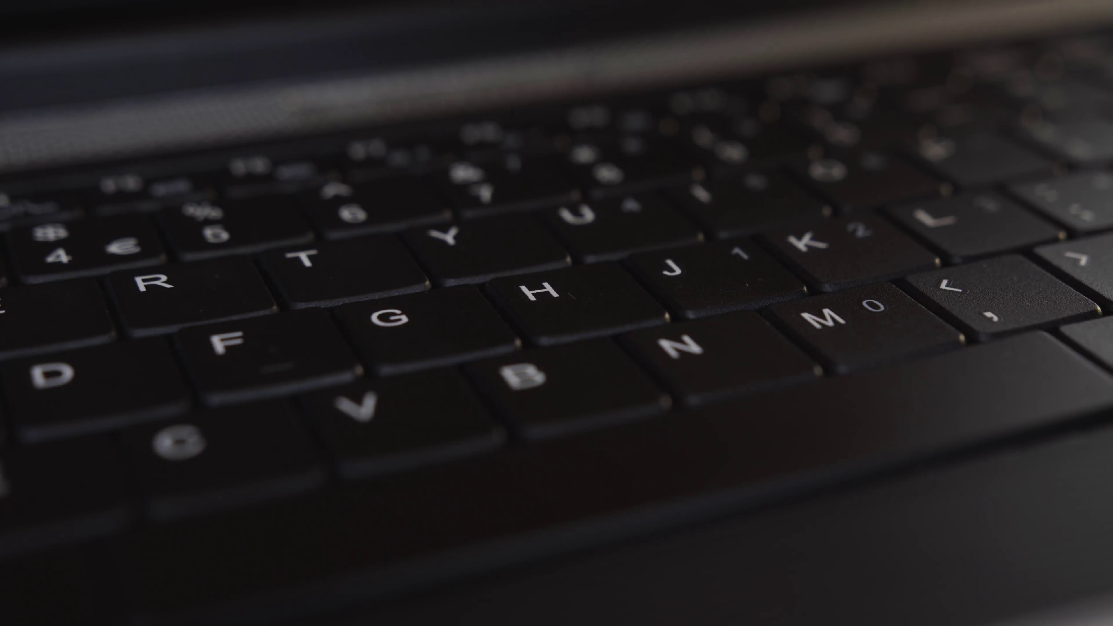 Black Computer keyboard extreme close up UHD stock footage. A black ...