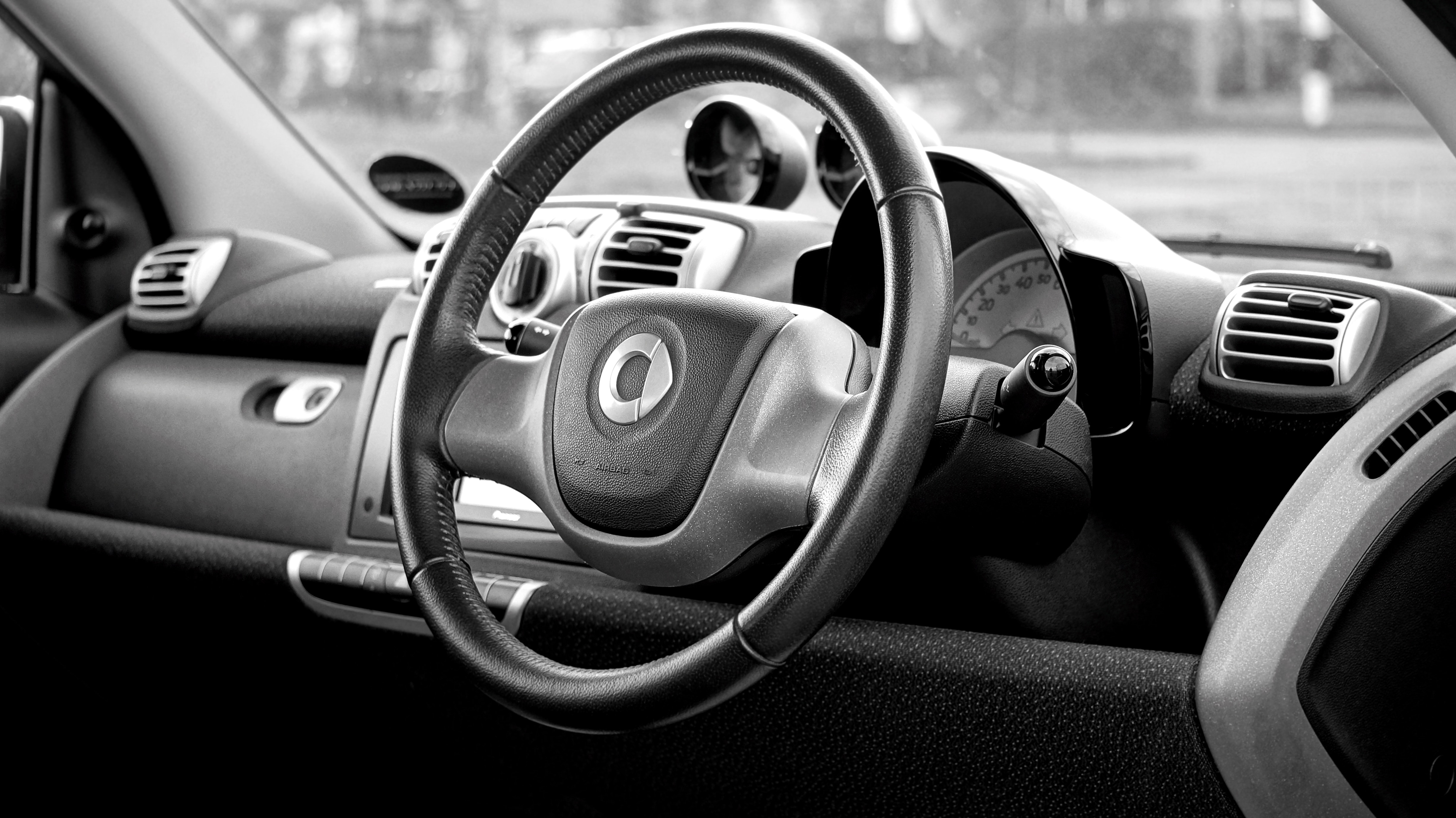 Black smart car steering wheel photo