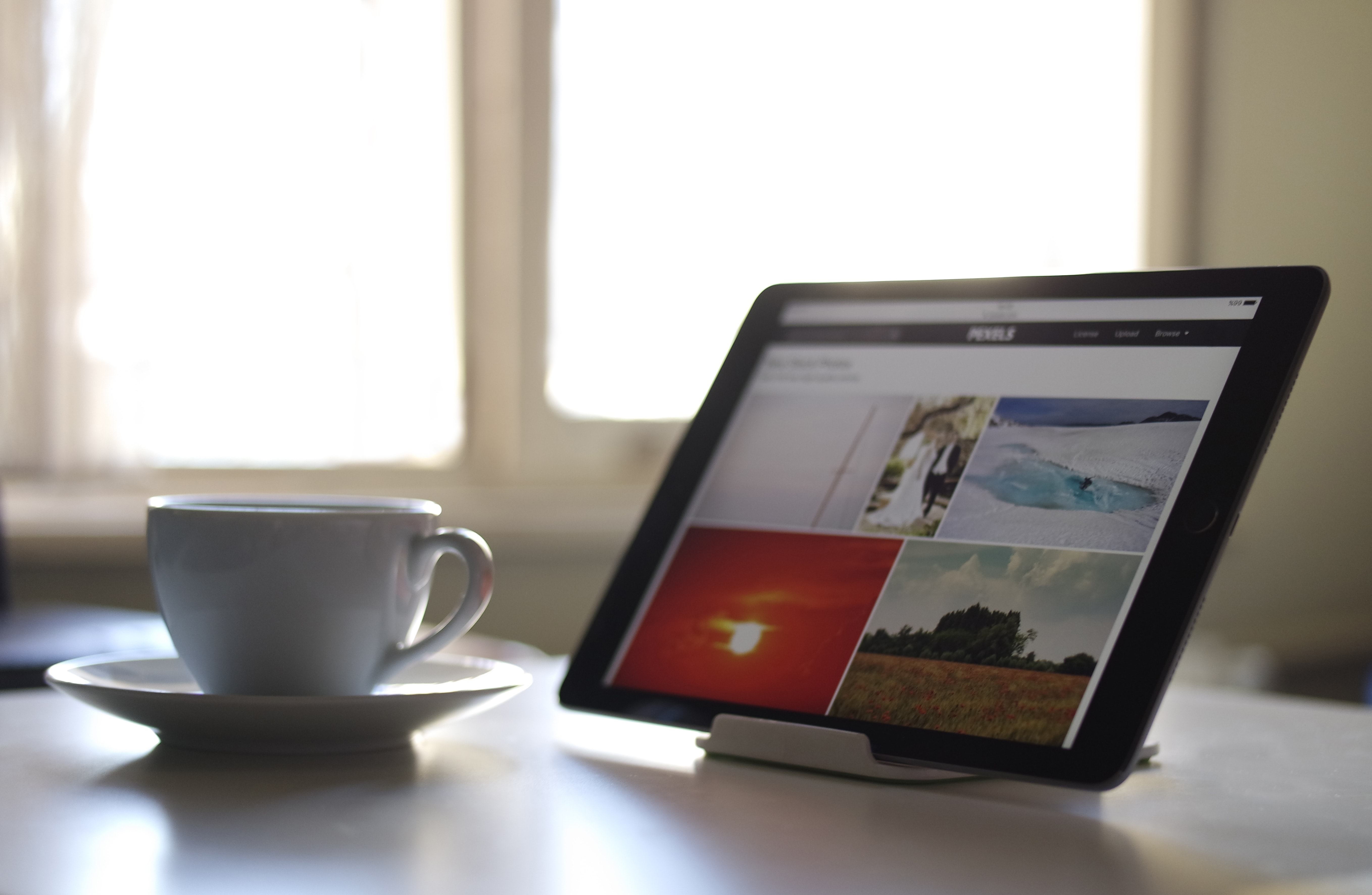 Black Tablet Computer Near a White Ceramic Teacup, Bright day, Saucer, Work, Wireless, HQ Photo