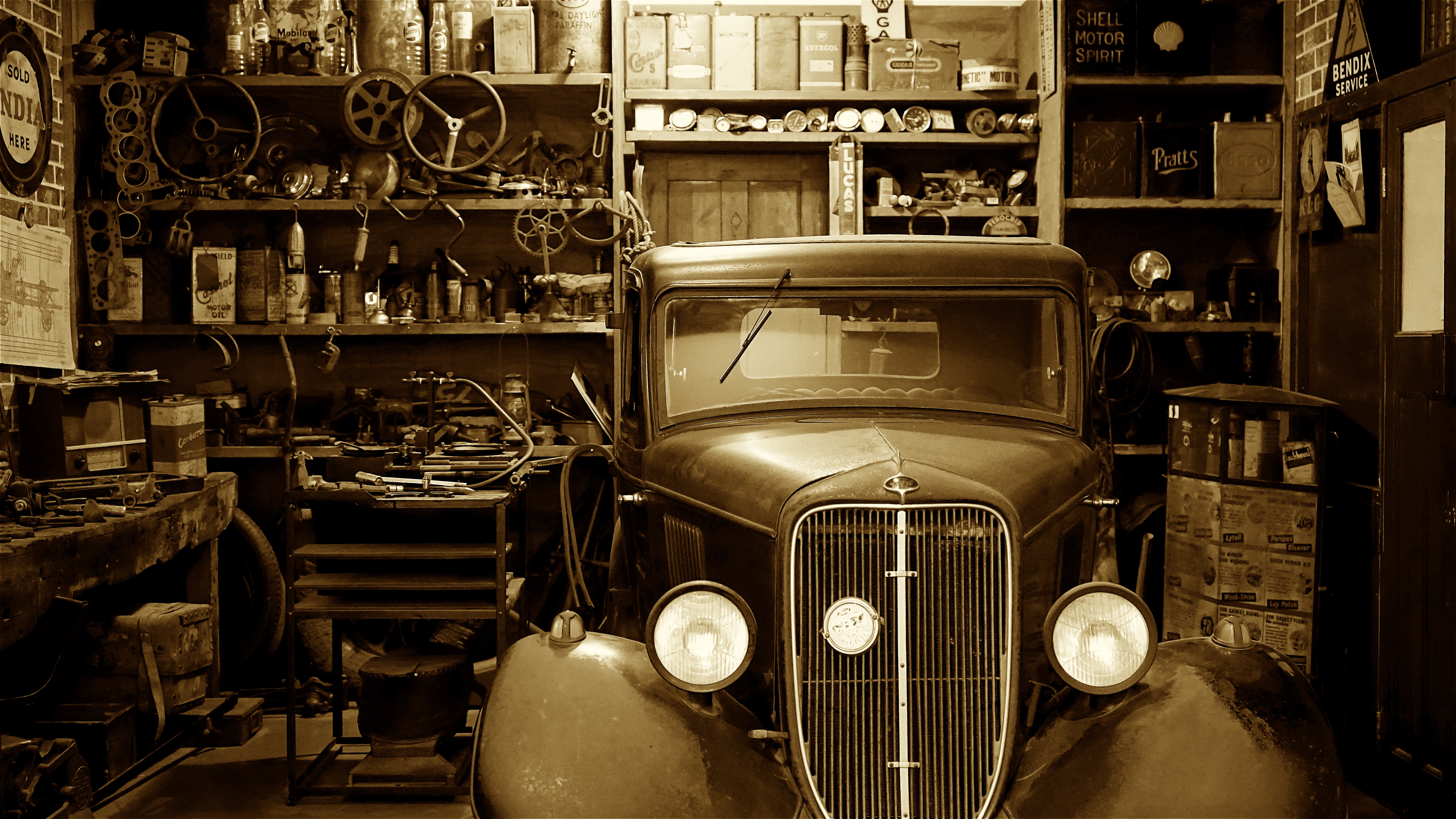 Black vintage car on garage photo