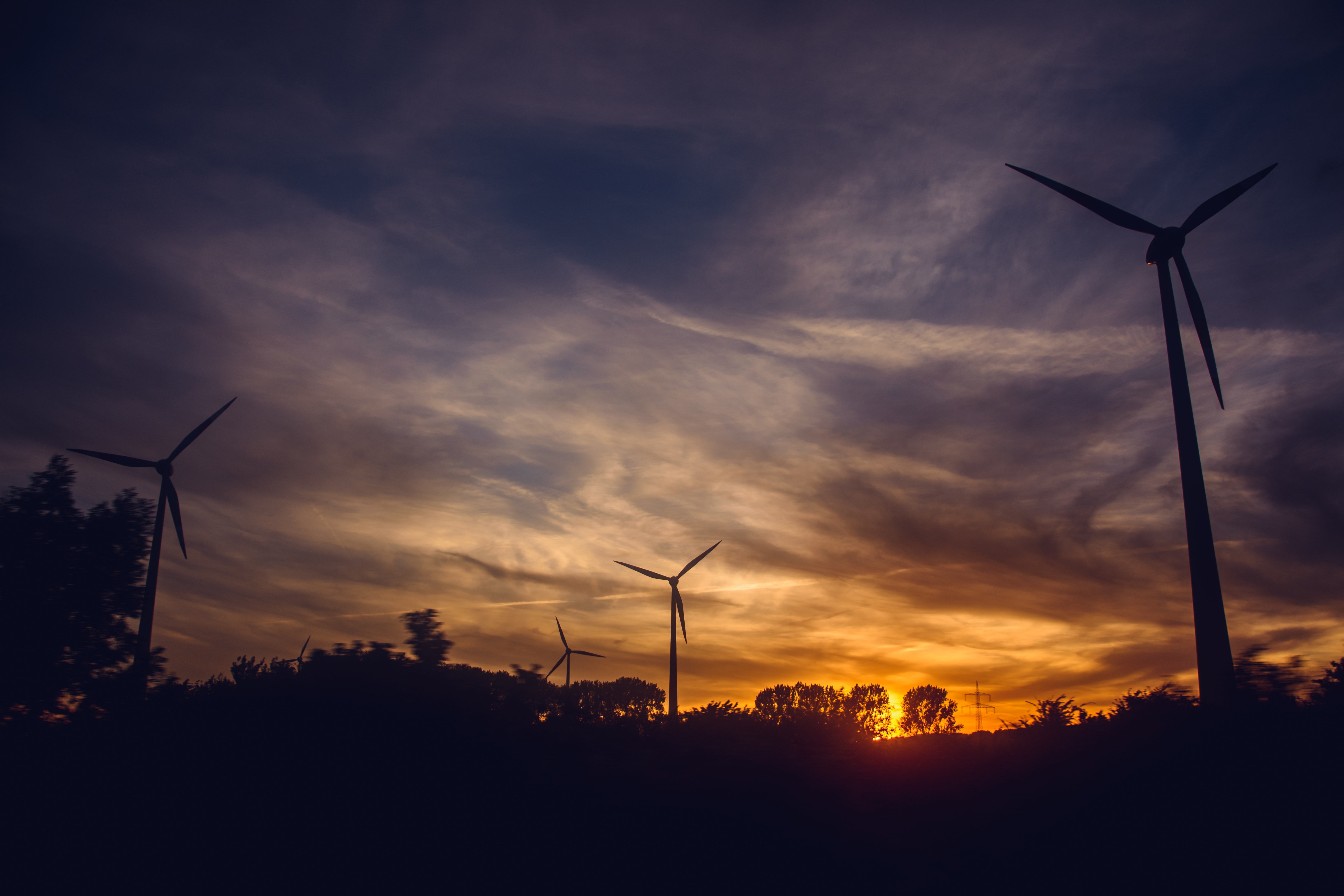 Black windmills during sunset photo