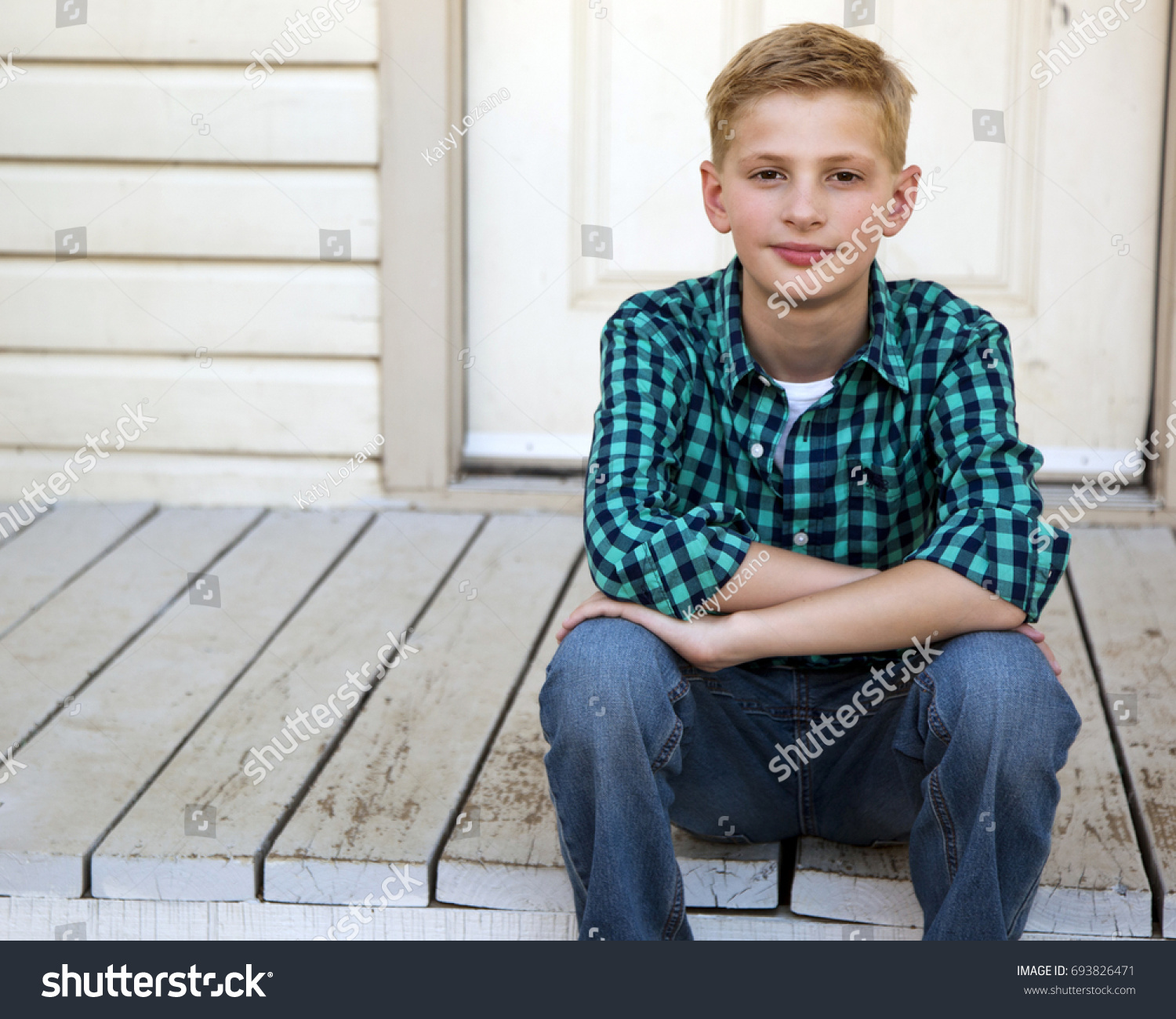 Blonde Young Boy Sitting On Steps Stock Photo & Image (Royalty-Free ...