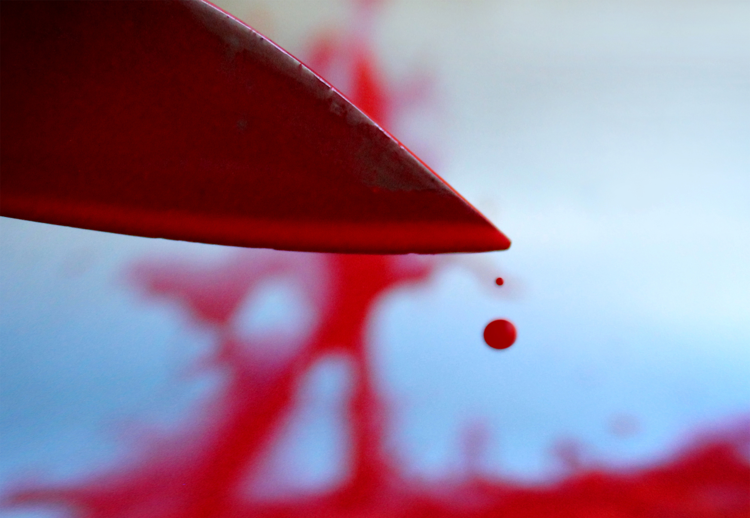 Bloody knife with blood drops photo