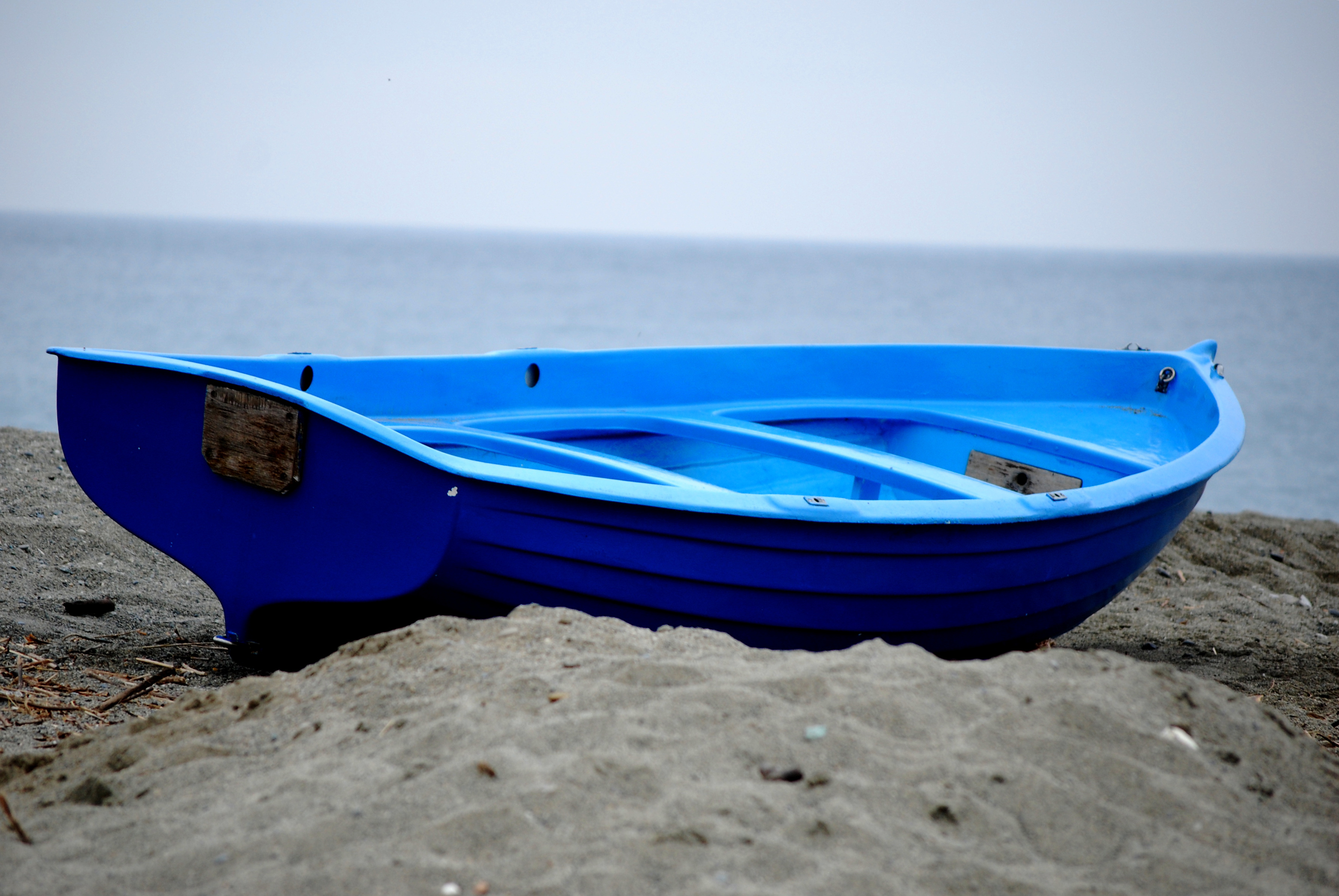 Blue boat on the beach at the resort of Celle Ligure, Italy ...