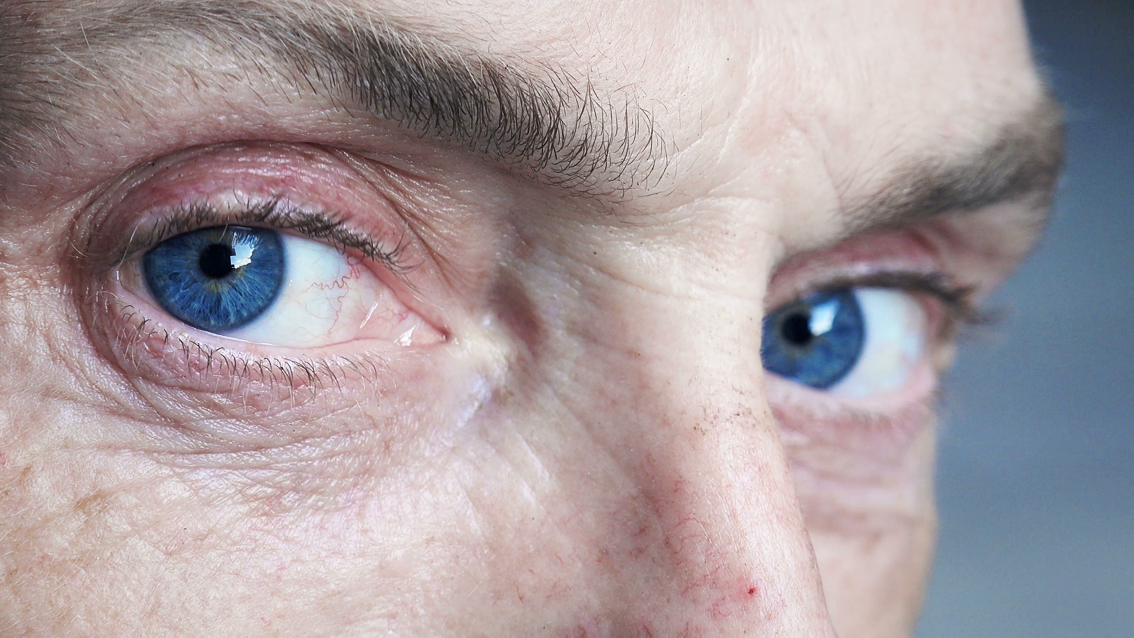 close up footage on old man's eyes: blue eyes, pensive old man Stock ...