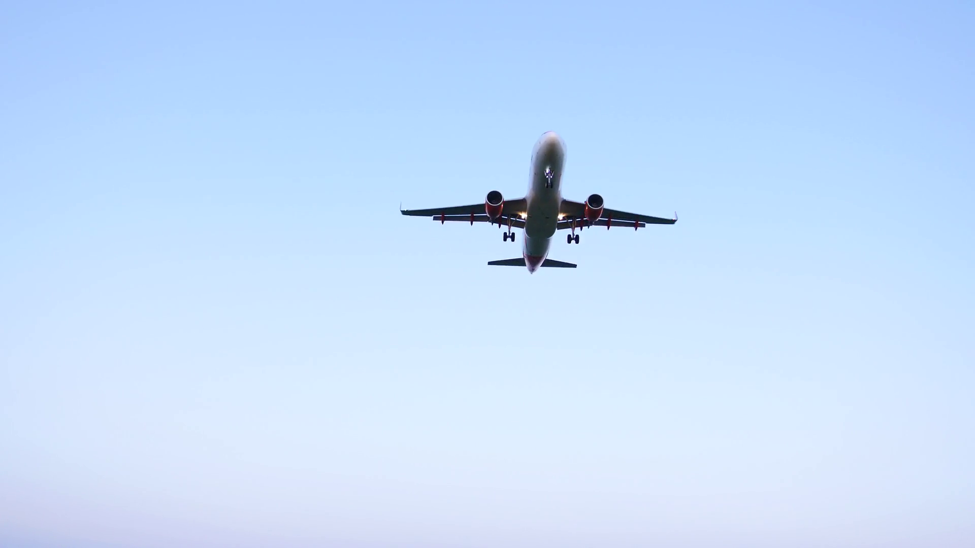 Airplane Flying Overhead against Blue Sky - Taking Off / Landing ...