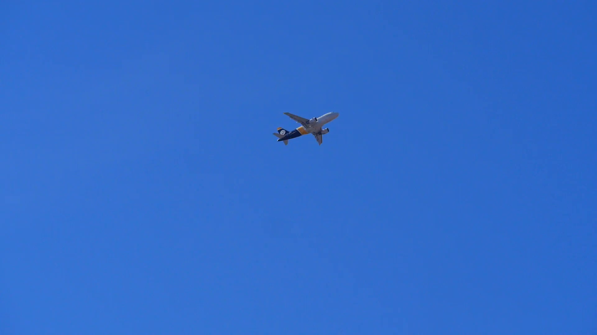Airplane flying across clear blue sky Stock Video Footage - Videoblocks