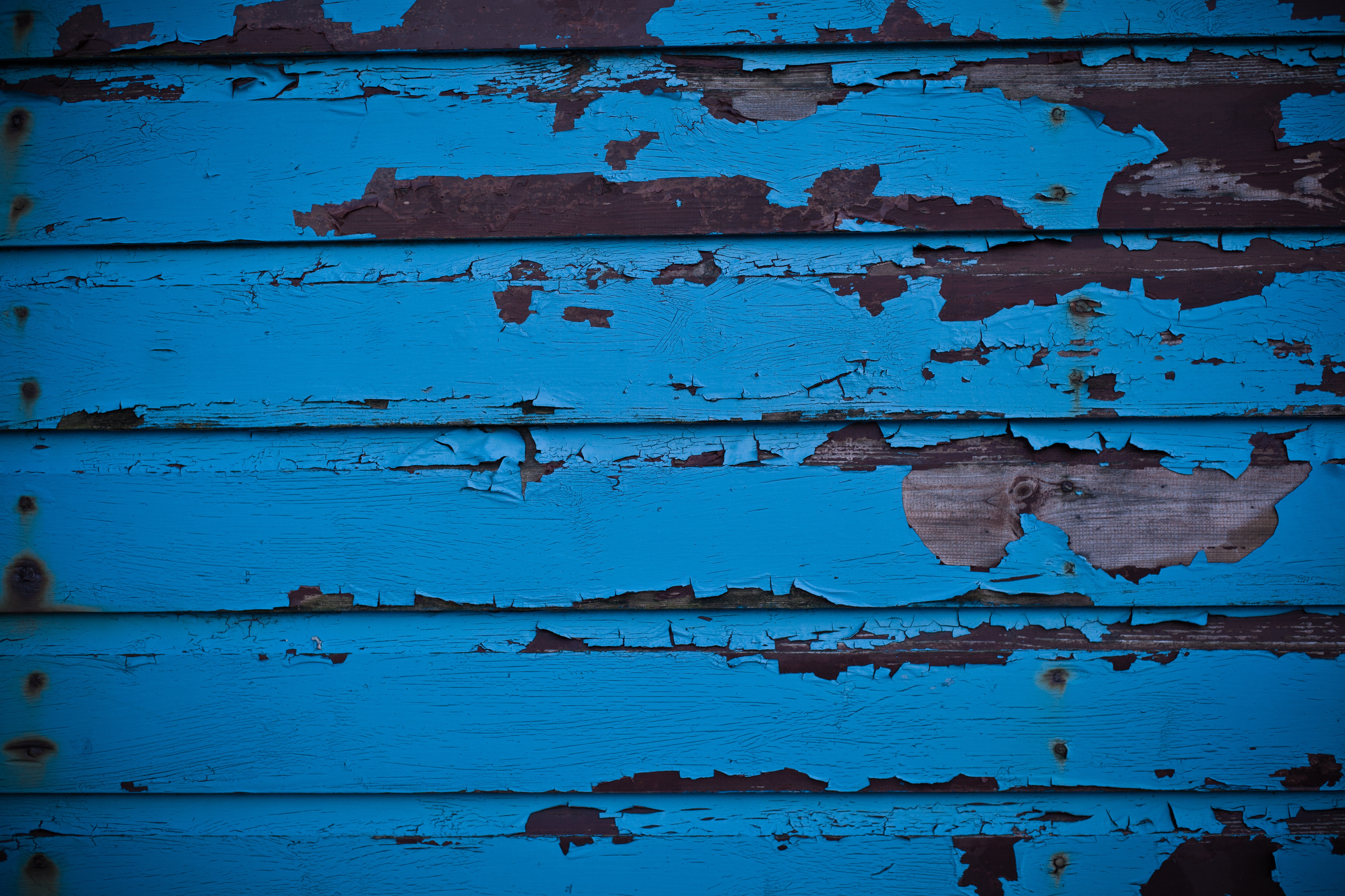 Blue peeled paint on wood texture photo