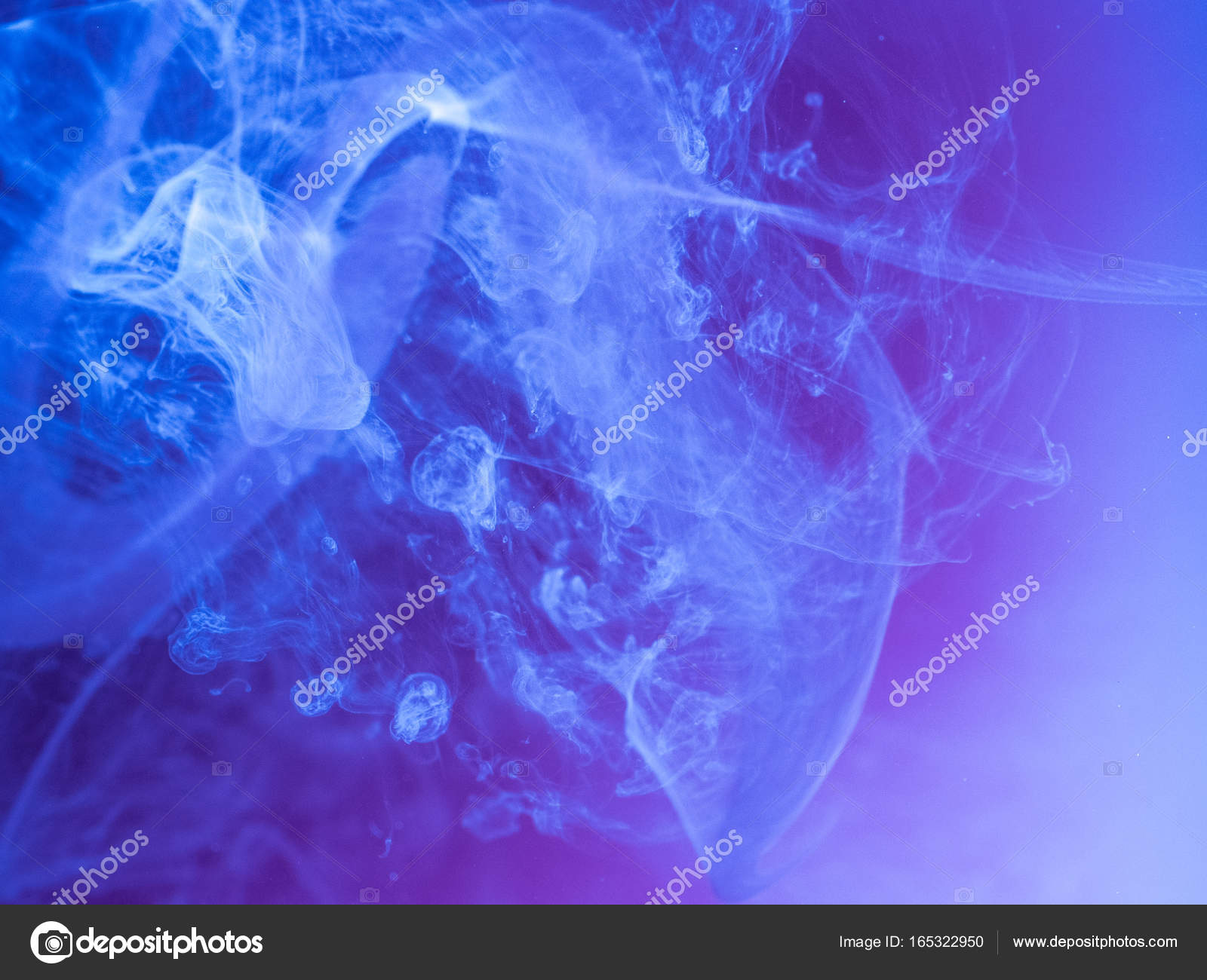Abstract colored background. Blue smoke, ink in water, the patterns ...