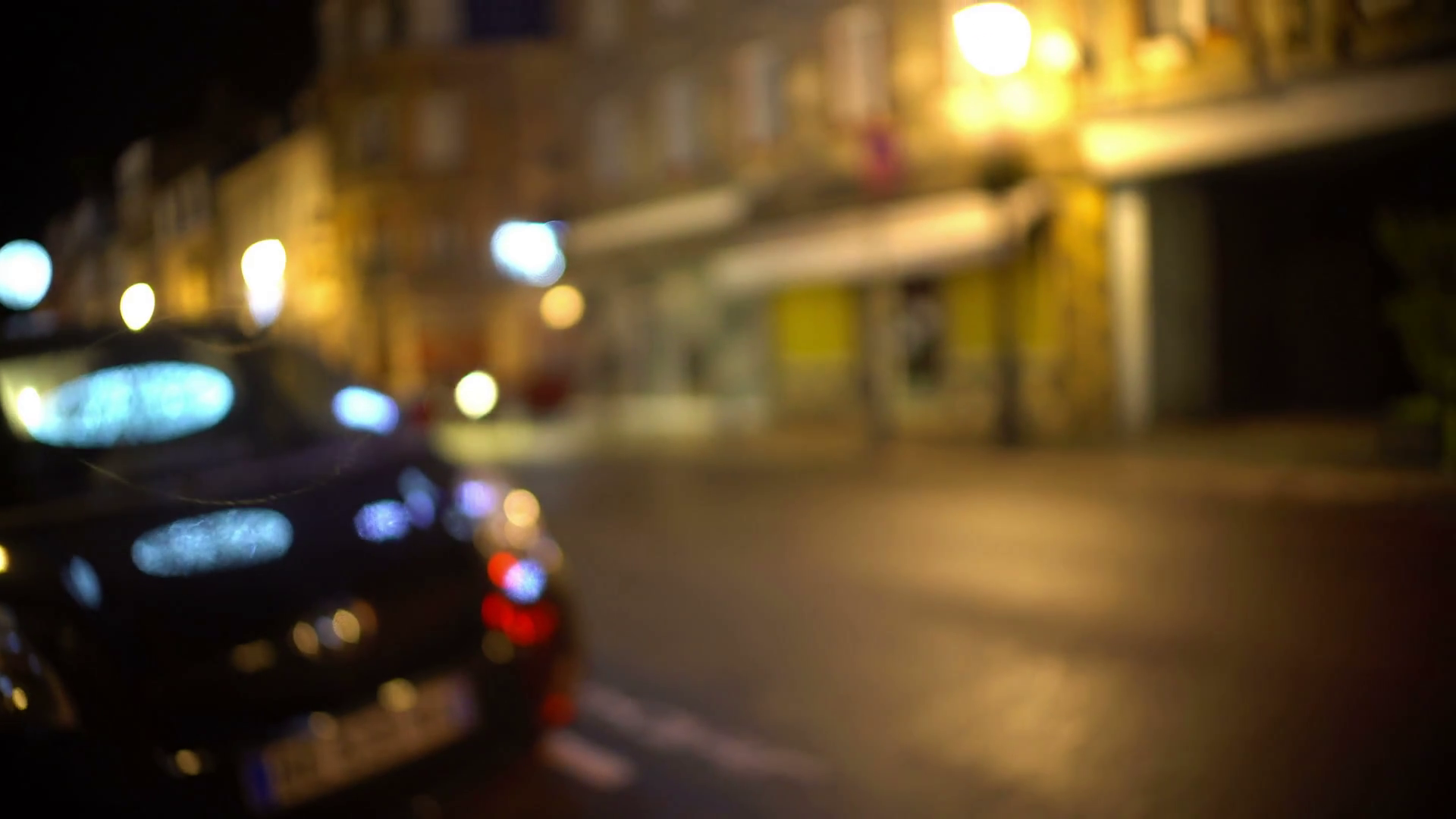 Drunk man POV looking for his car parked near bar, blurred vision ...
