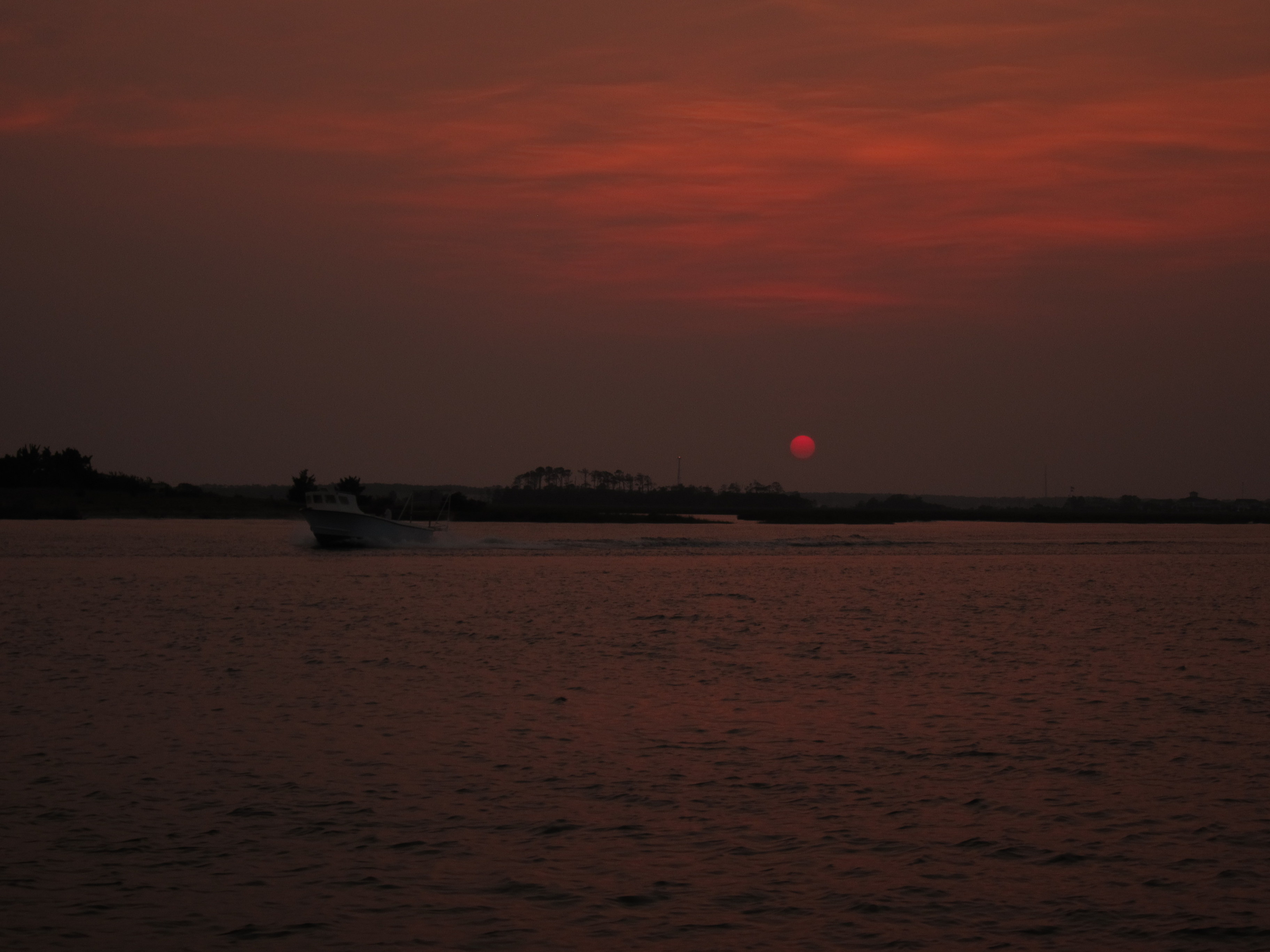 Boat at sunset photo