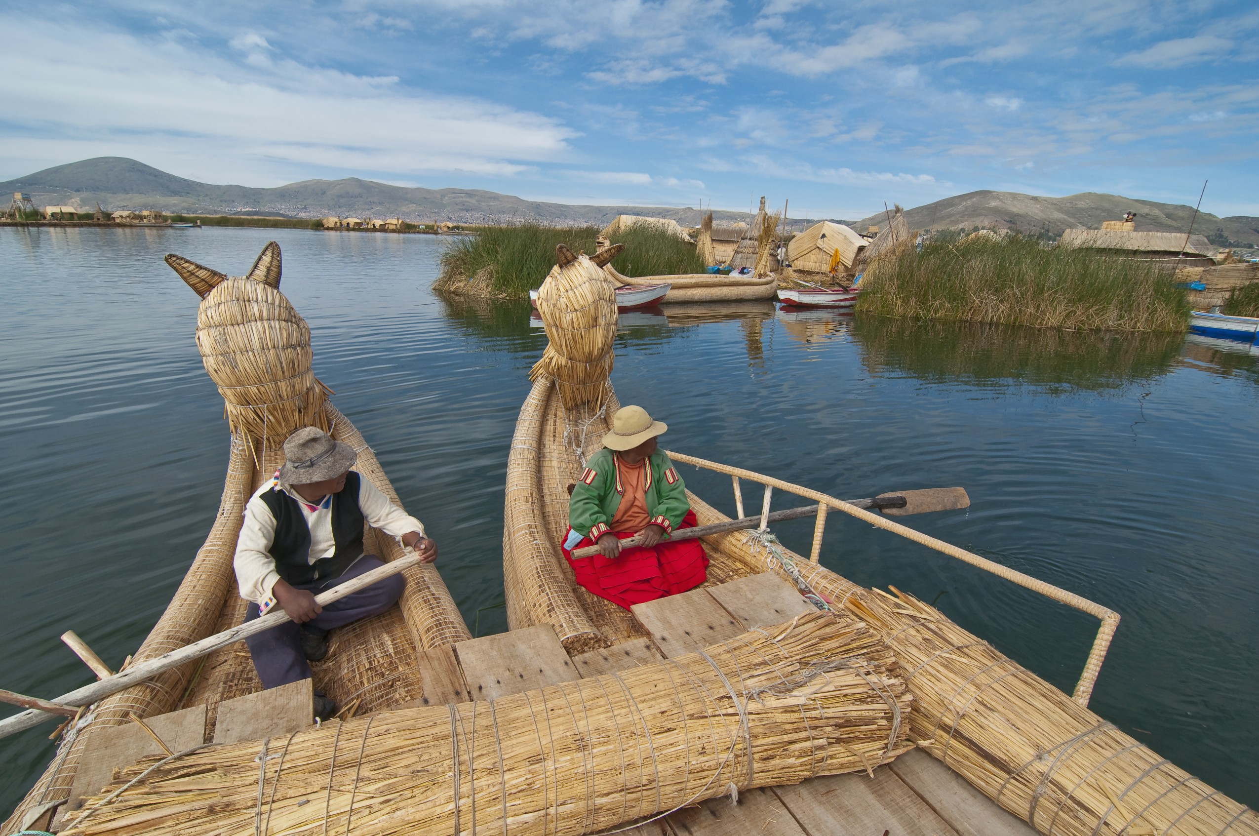 10 unusual types of transport Uros villagers carrying totora reeds ...