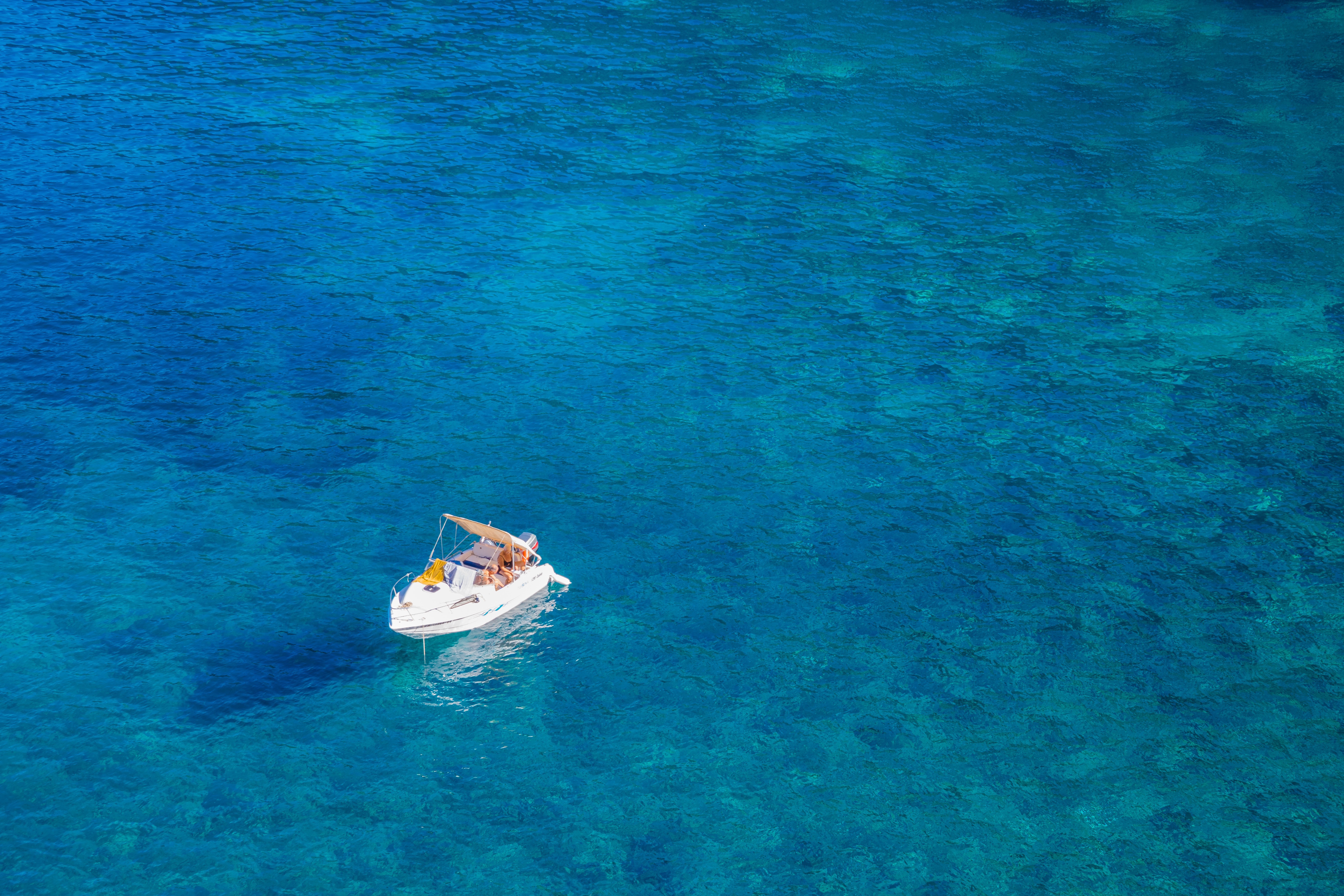 Boat in the middle of the ocean photo