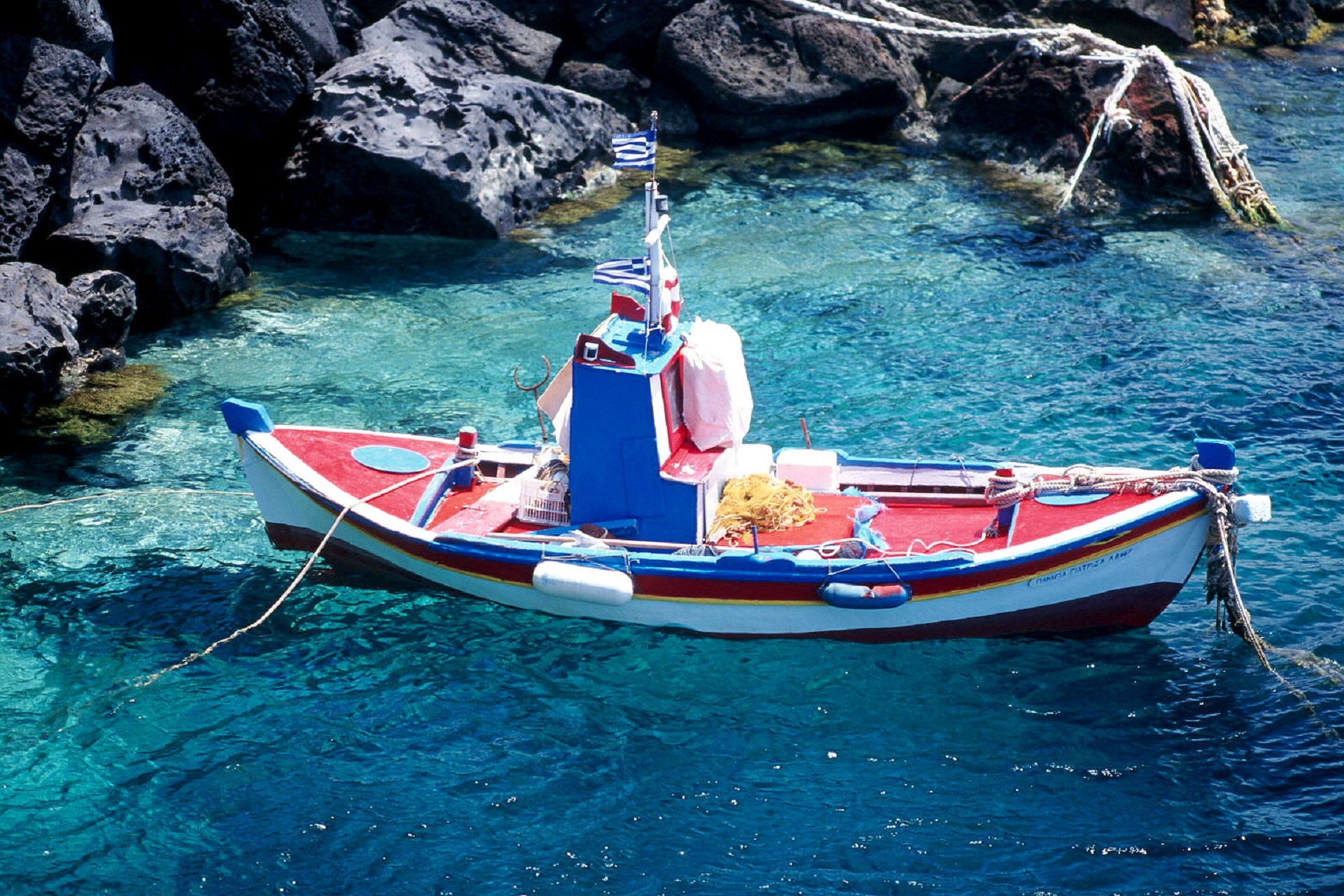 Boat on the santorini island photo