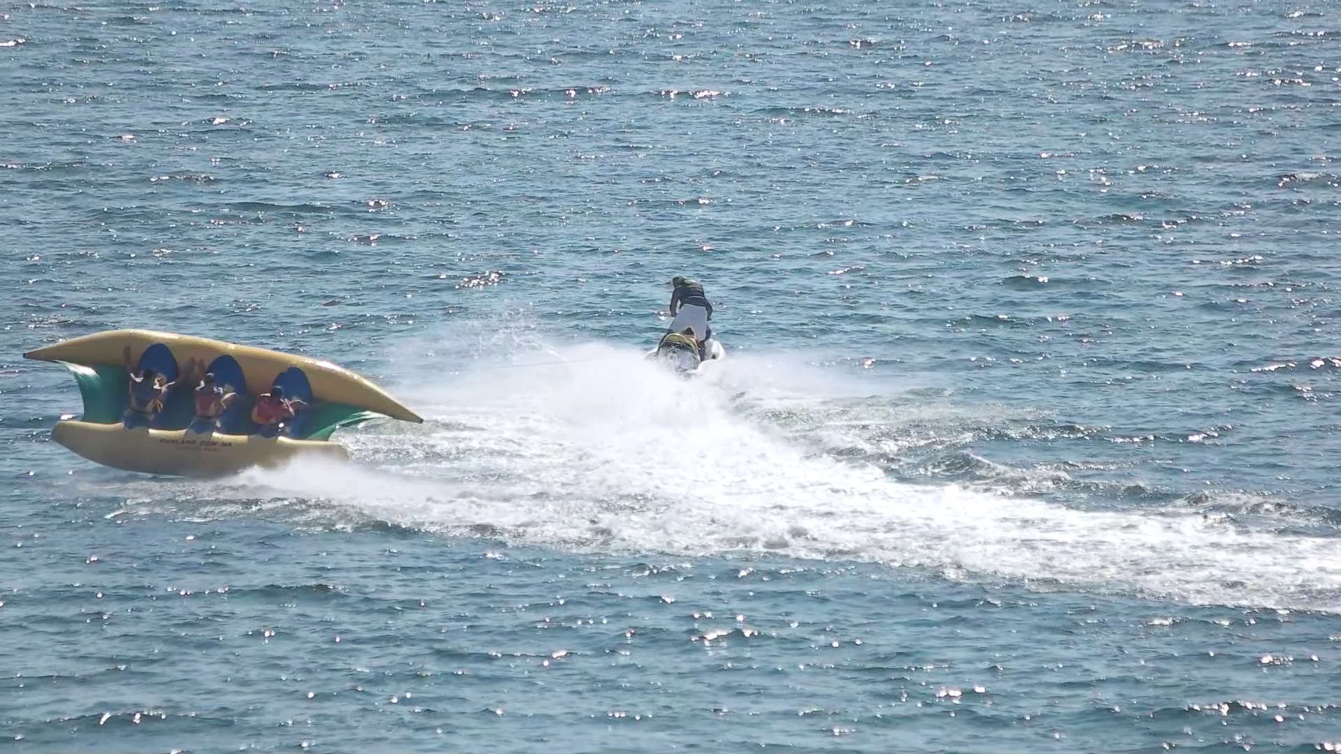 Flying banana boat ride. Jet ski in slow motion. Stock Video Footage ...