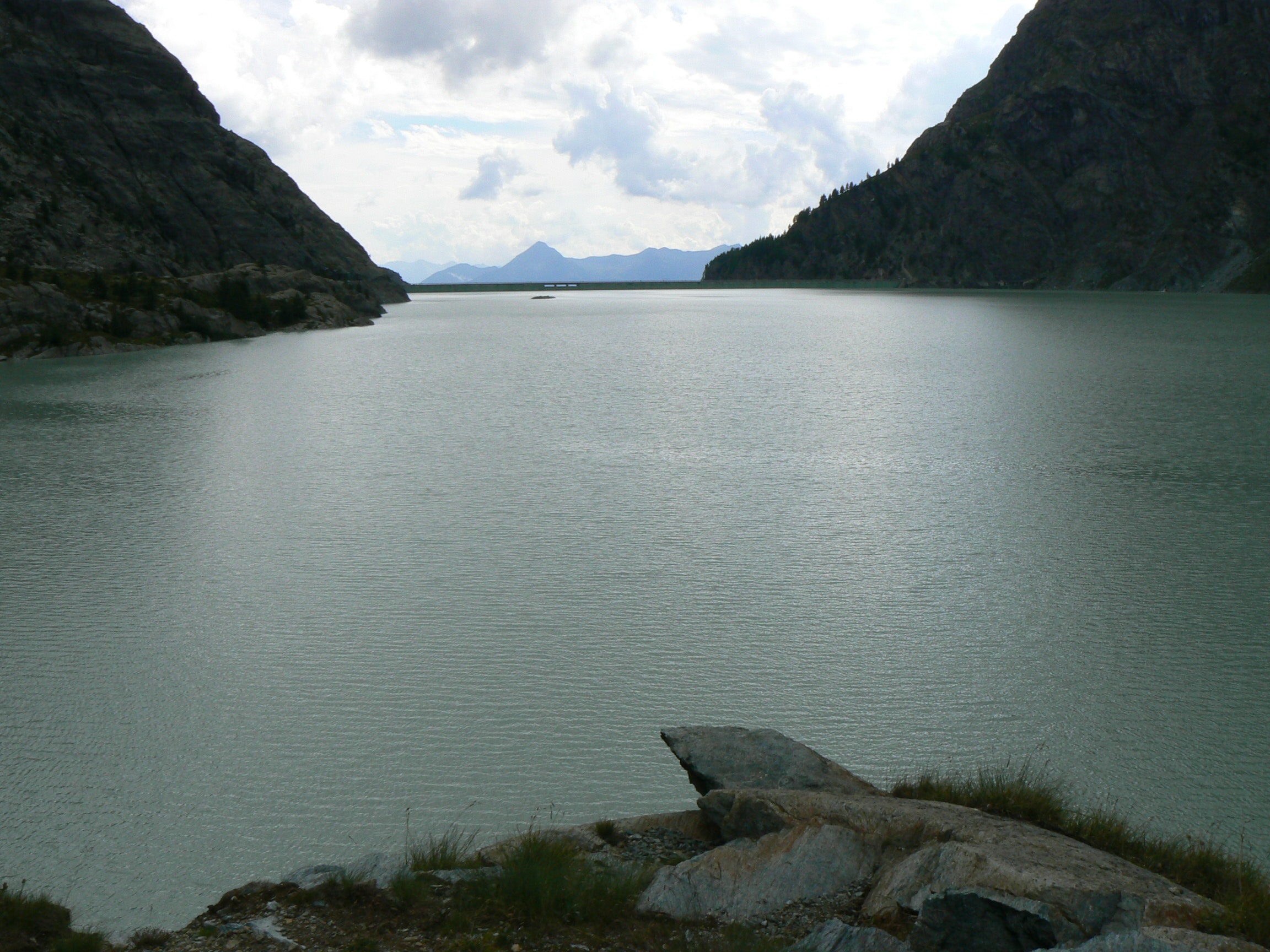Body of water and mountain during daytime photo