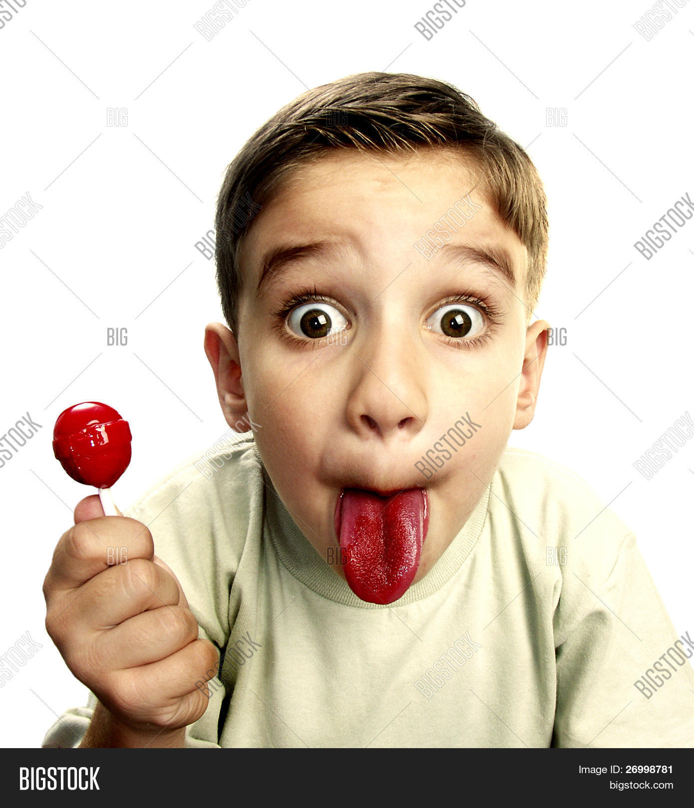 Boy eating lollipop photo