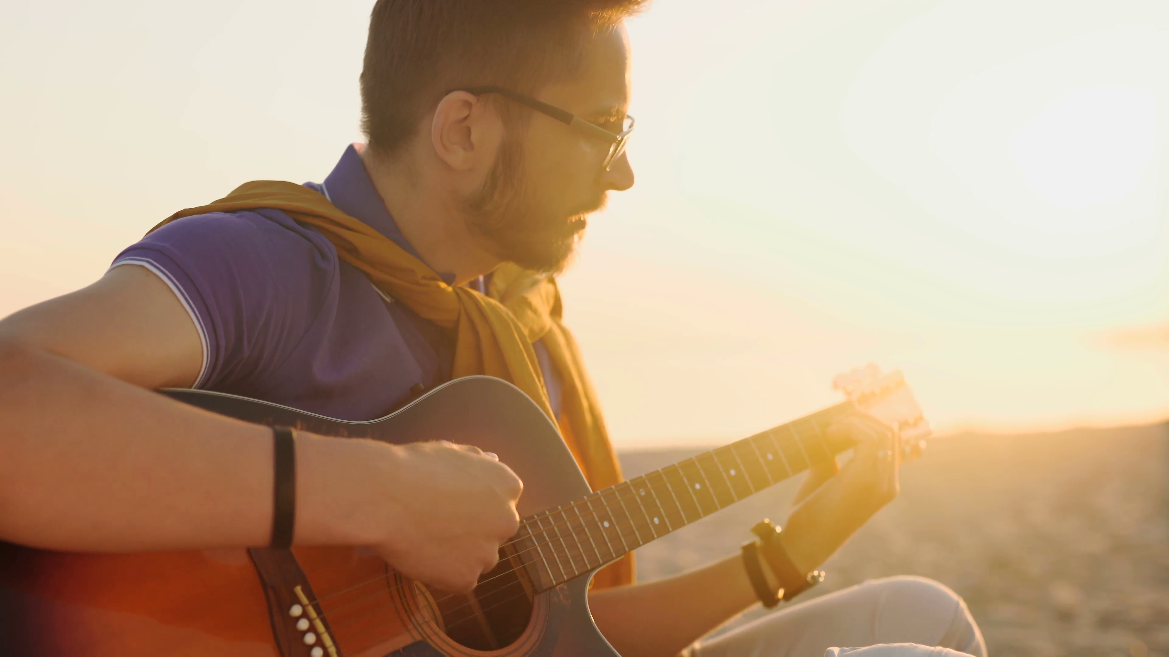 young boy plays guitar at sunset Stock Video Footage - Videoblocks