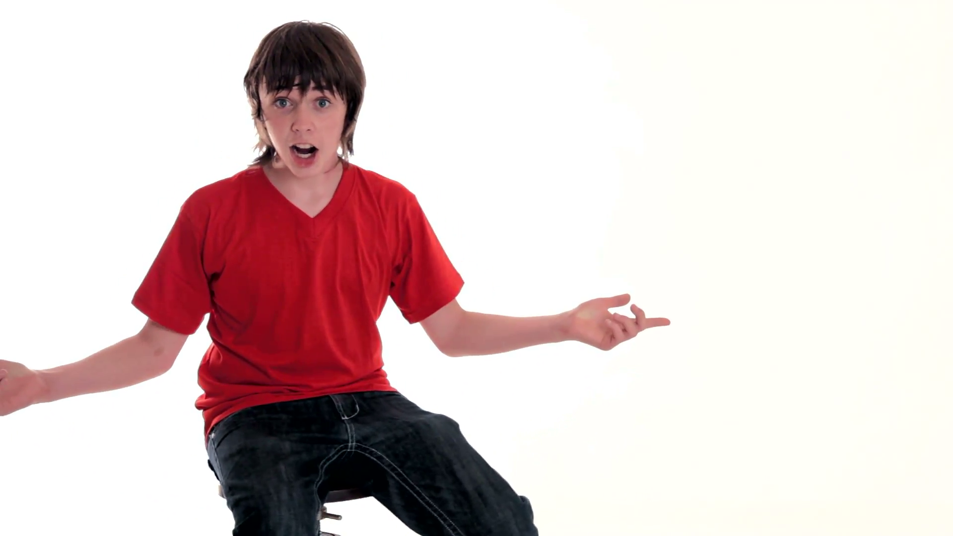 Teen boy making faces, sitting on a chair Stock Video Footage ...