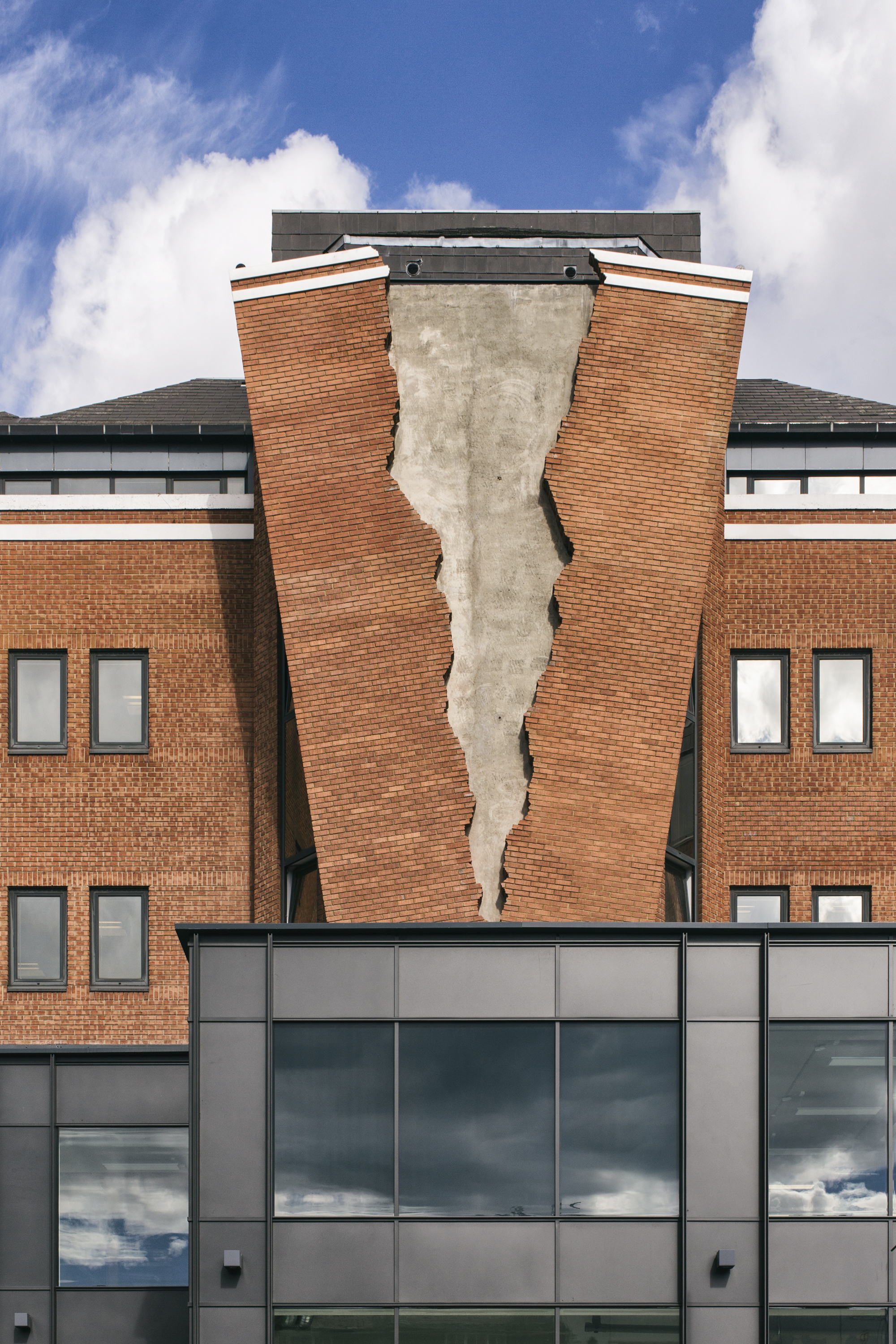 Artist Alex Chinneck Installs Ripped Brick Facade on London Building ...