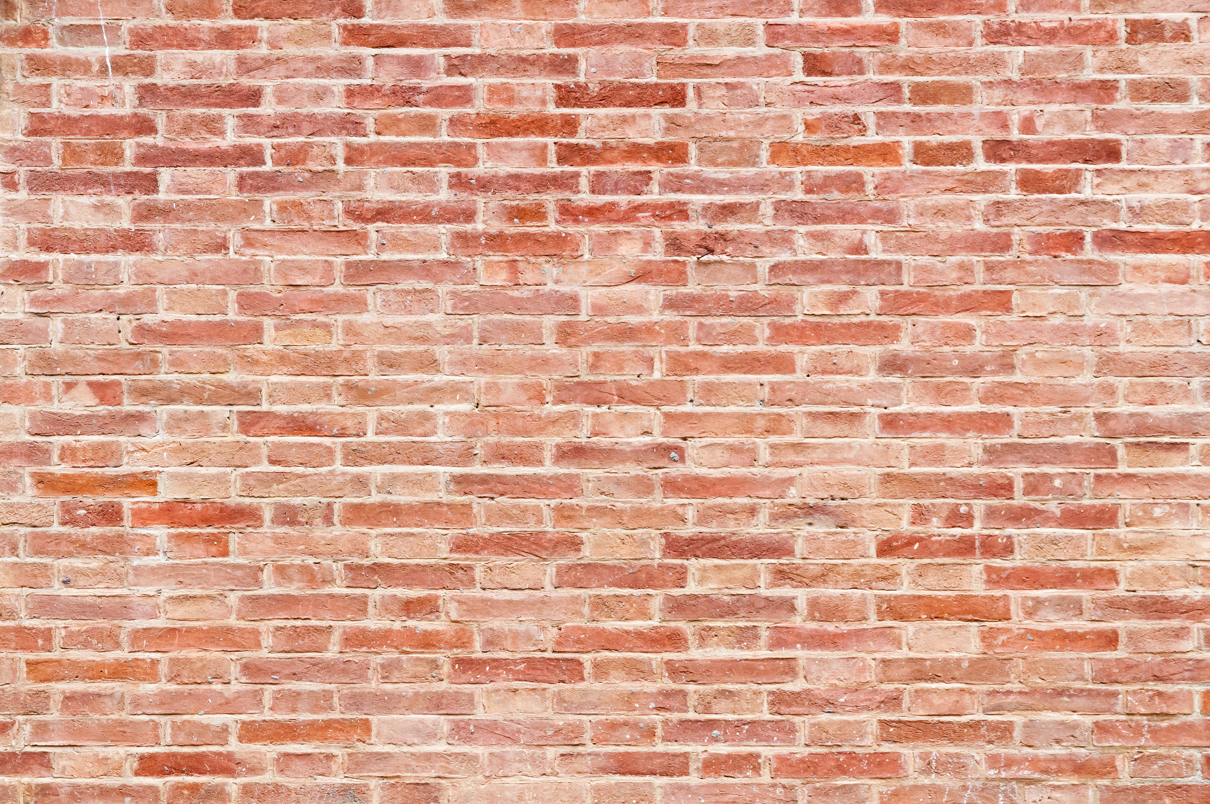 Stone red brick wall background | CommTech, LLC