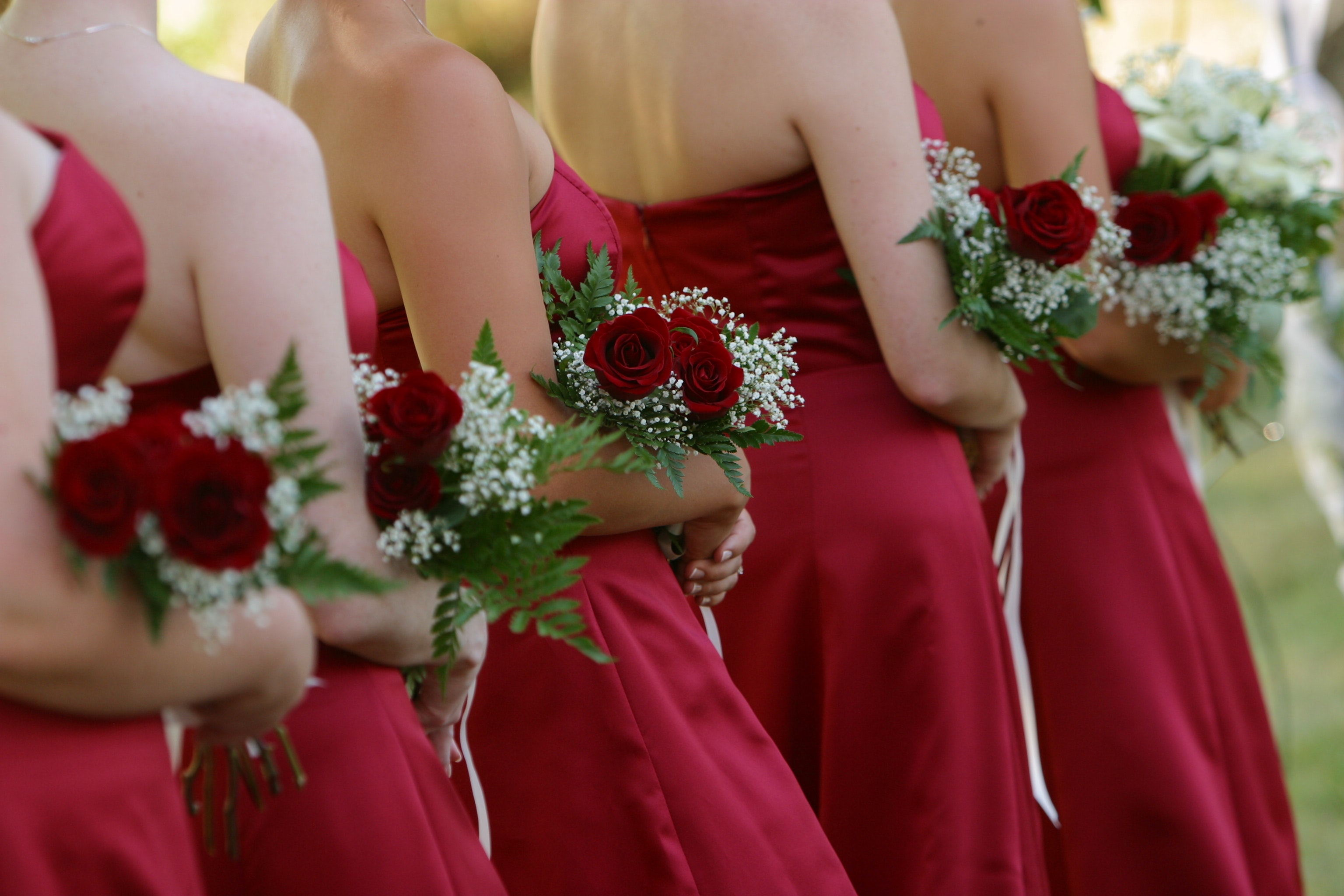 Brides groom wearing red cocktail dress photo