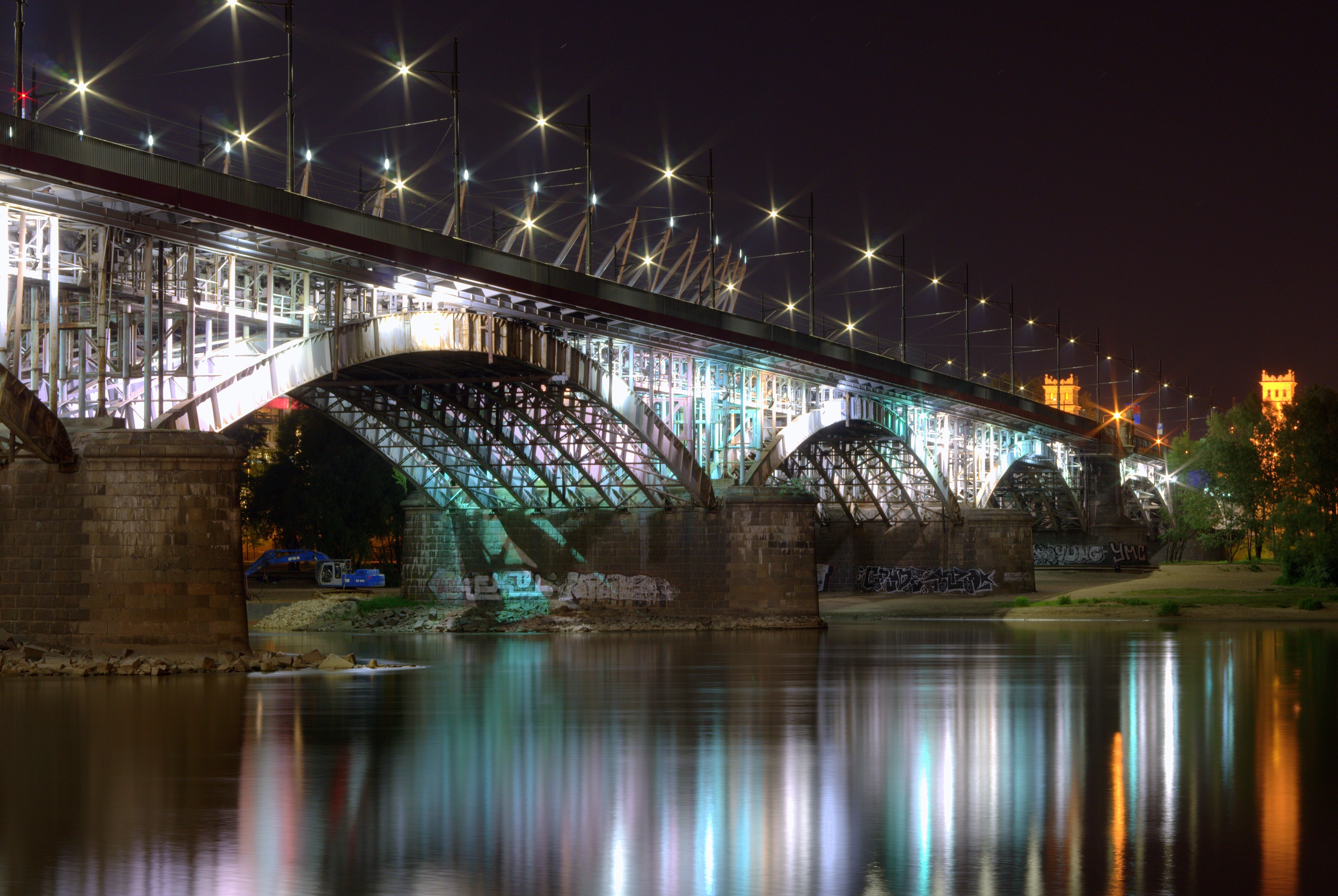 Bridge near body of water during night photo