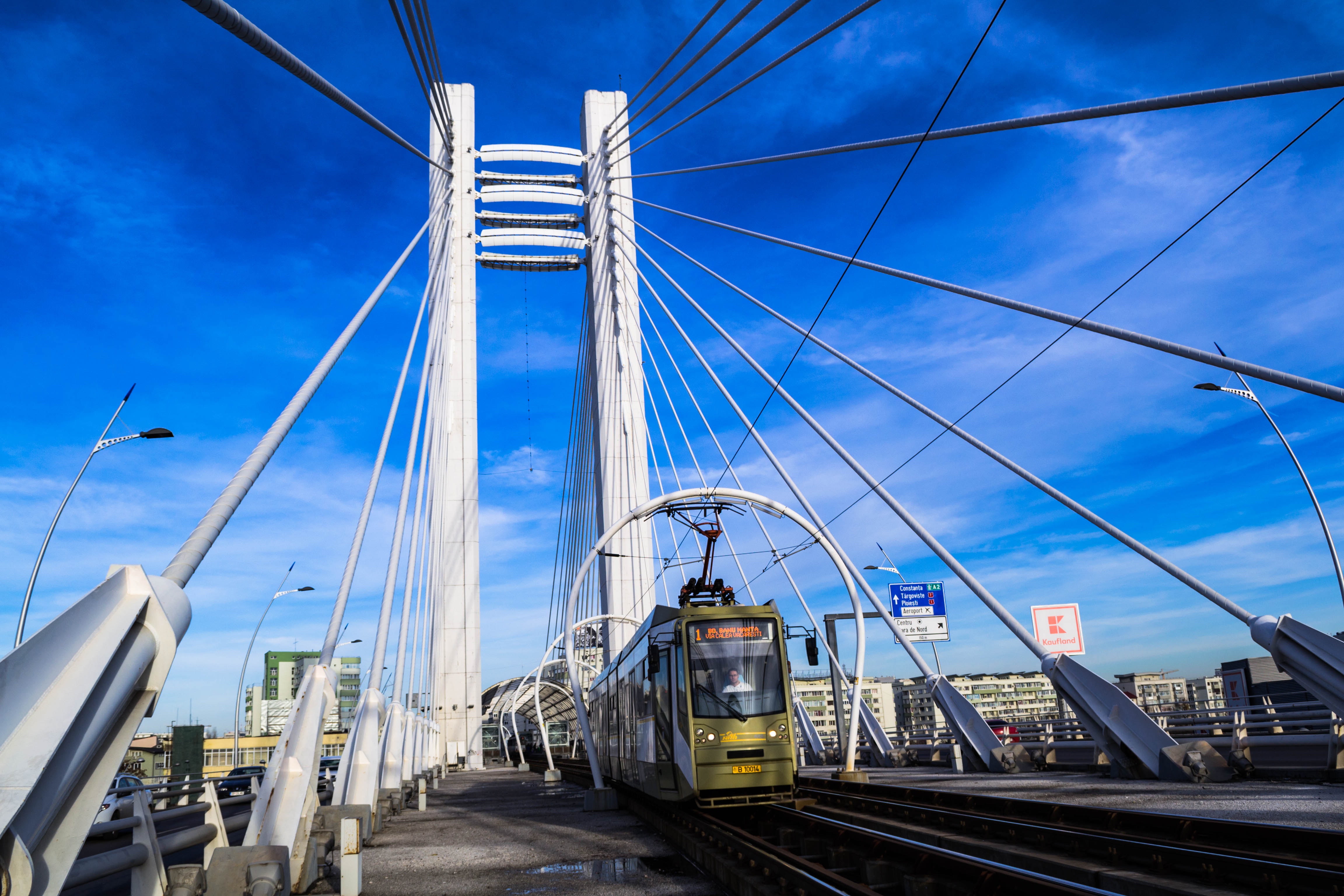 Bridge with train under blue sky photo