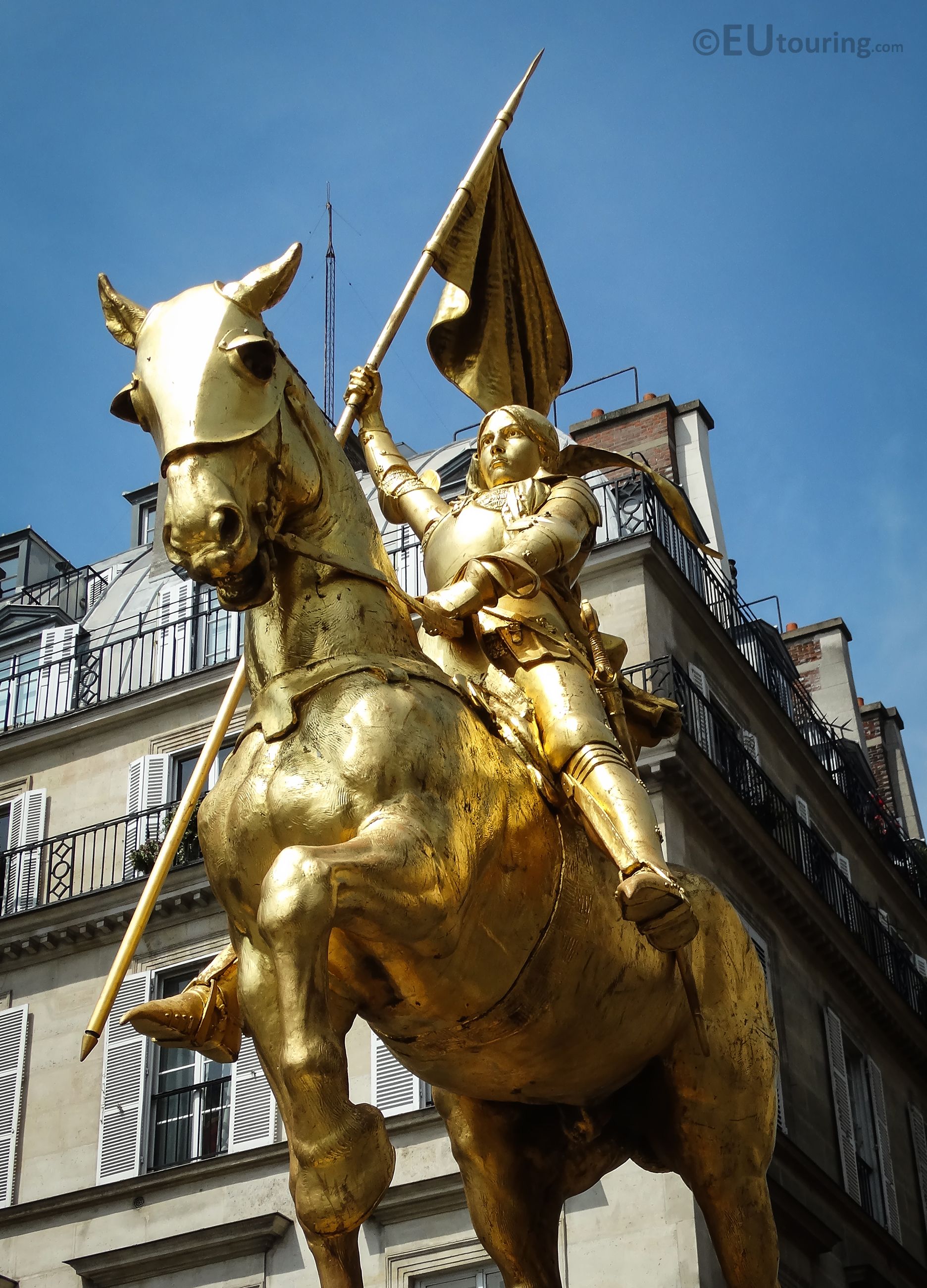 A close up view of the golden Joan of Arc statue found within Paris ...