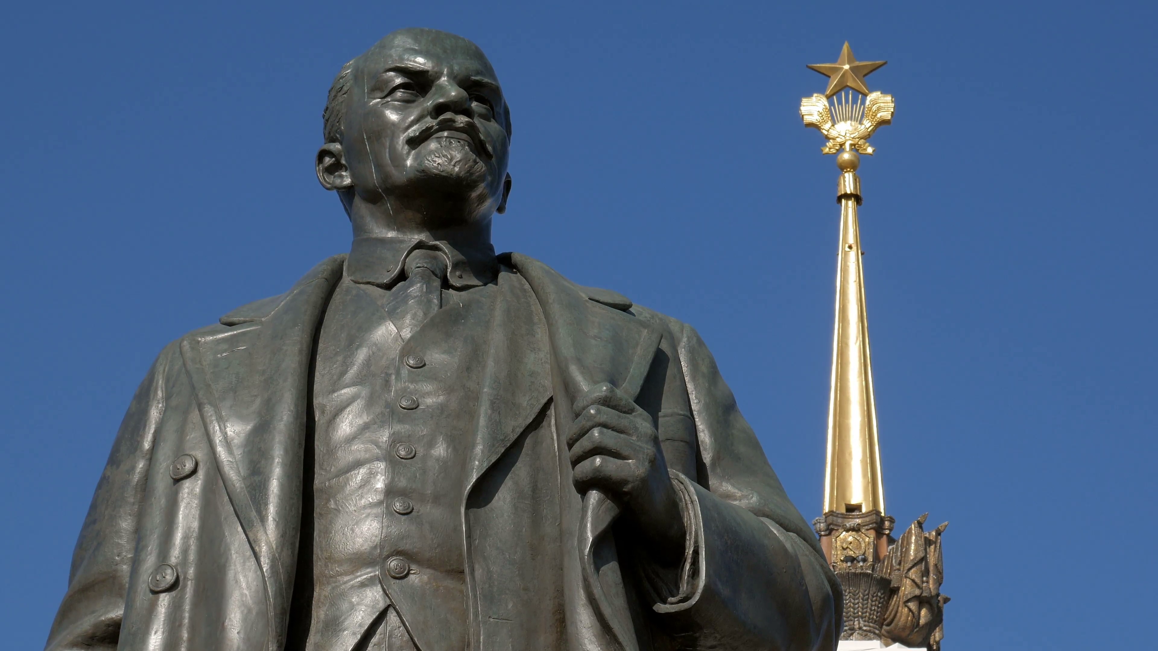 Lenin monument is on background of main pavilion of VDNKh, Moscow ...