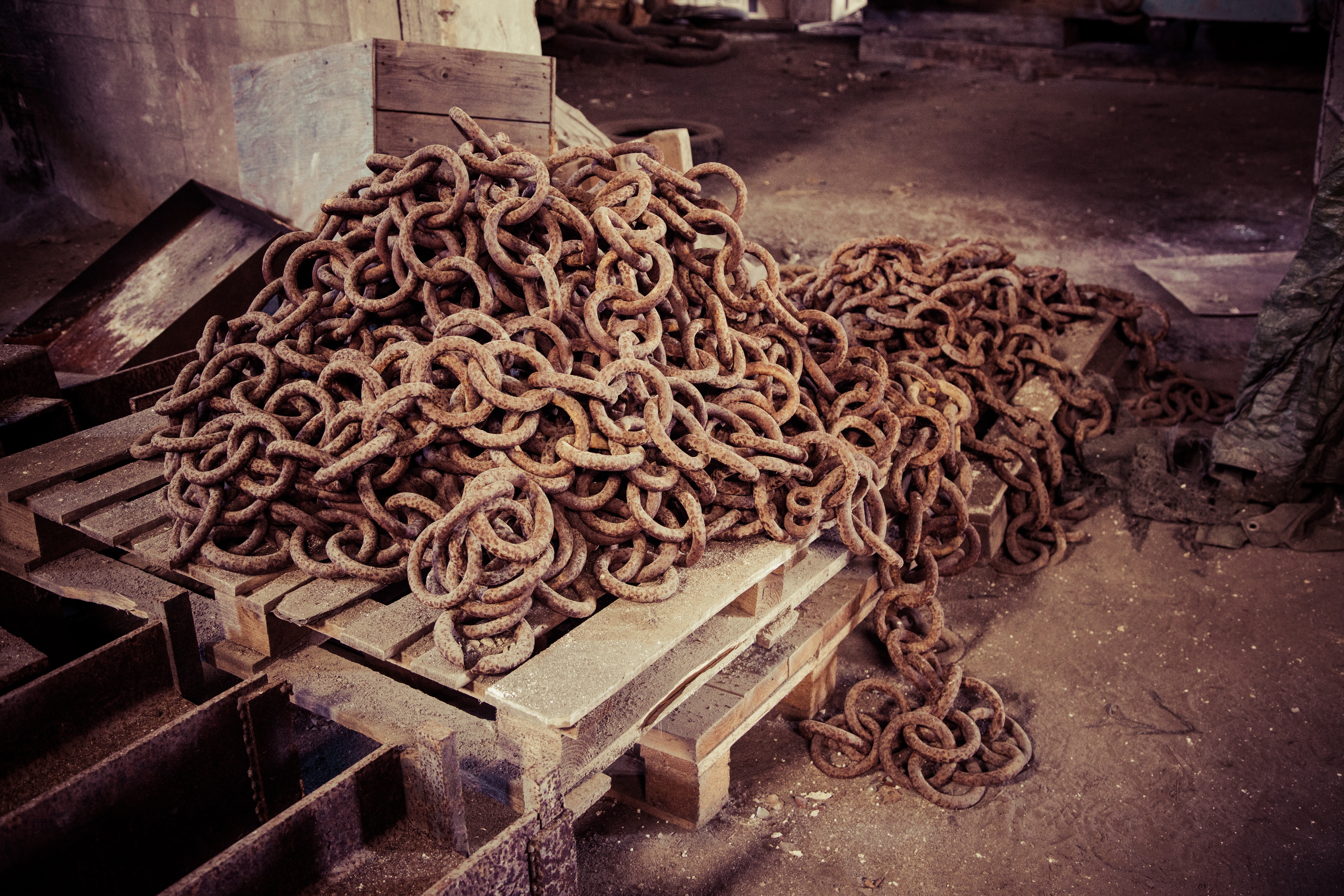 Brown chains on wooden palette photo