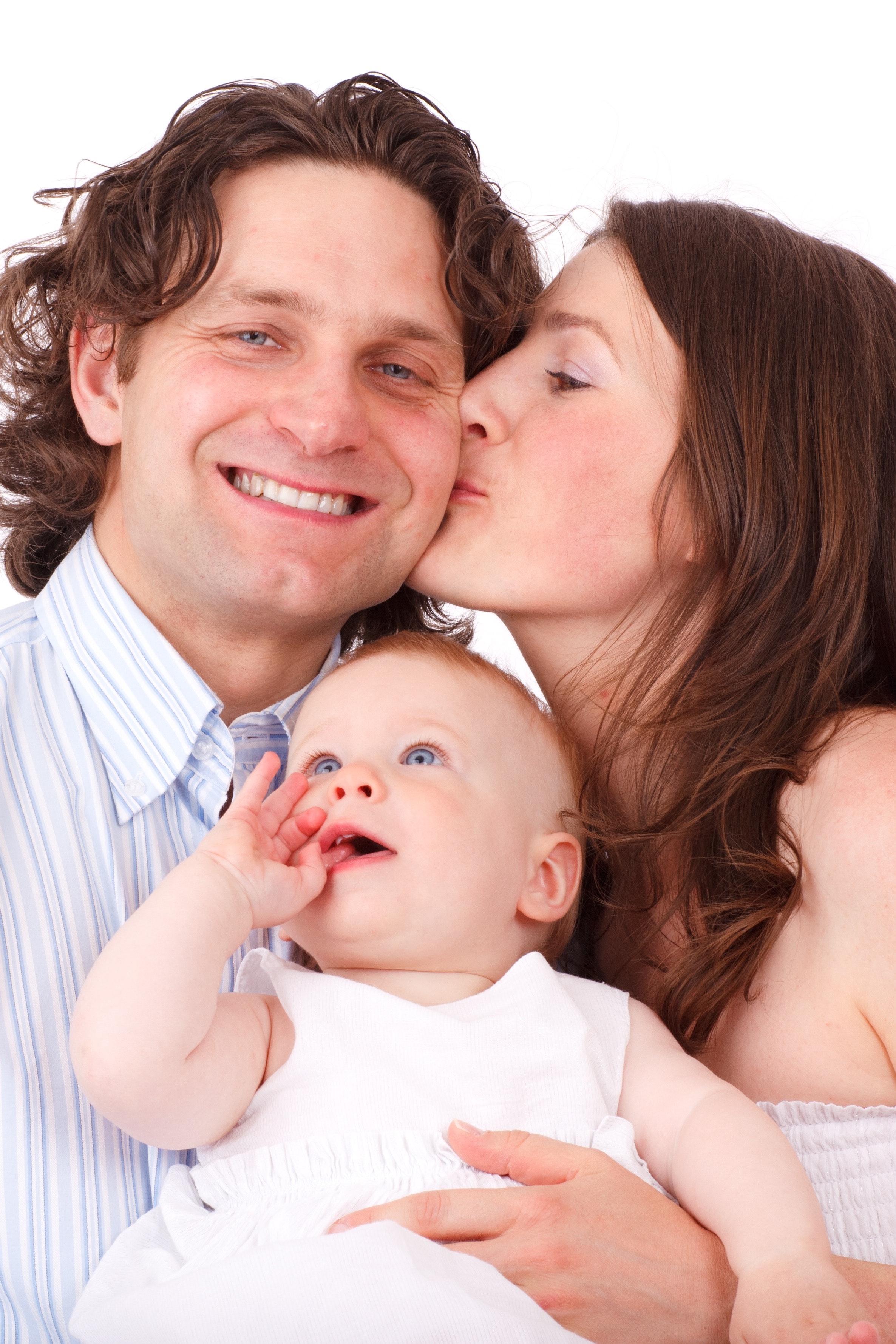 Brown Haired Woman Kissing Man in Blue White Dress Shirt Holding Baby in White Dress, Baby, Child, Family, Father, HQ Photo