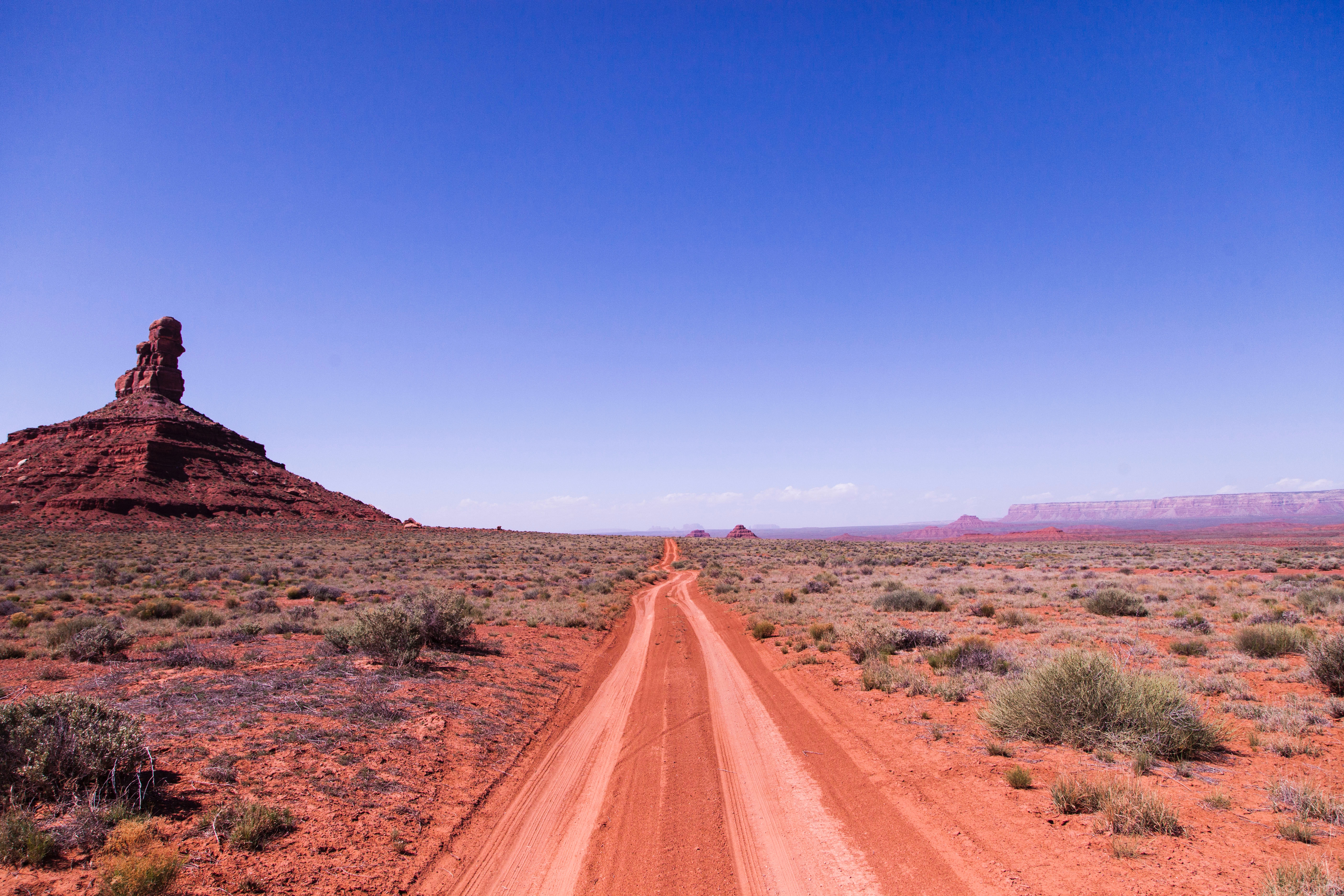 Brown soil road under clear sky photo