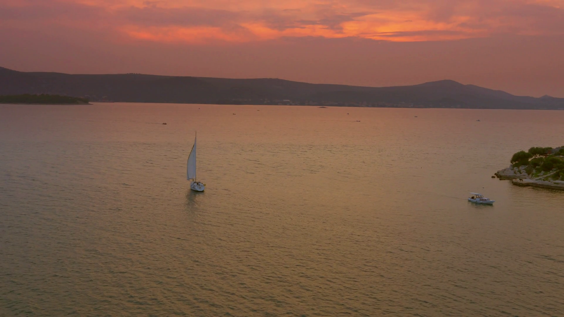 4K Aerial: Floating sailing boat at sunset Stock Video Footage ...