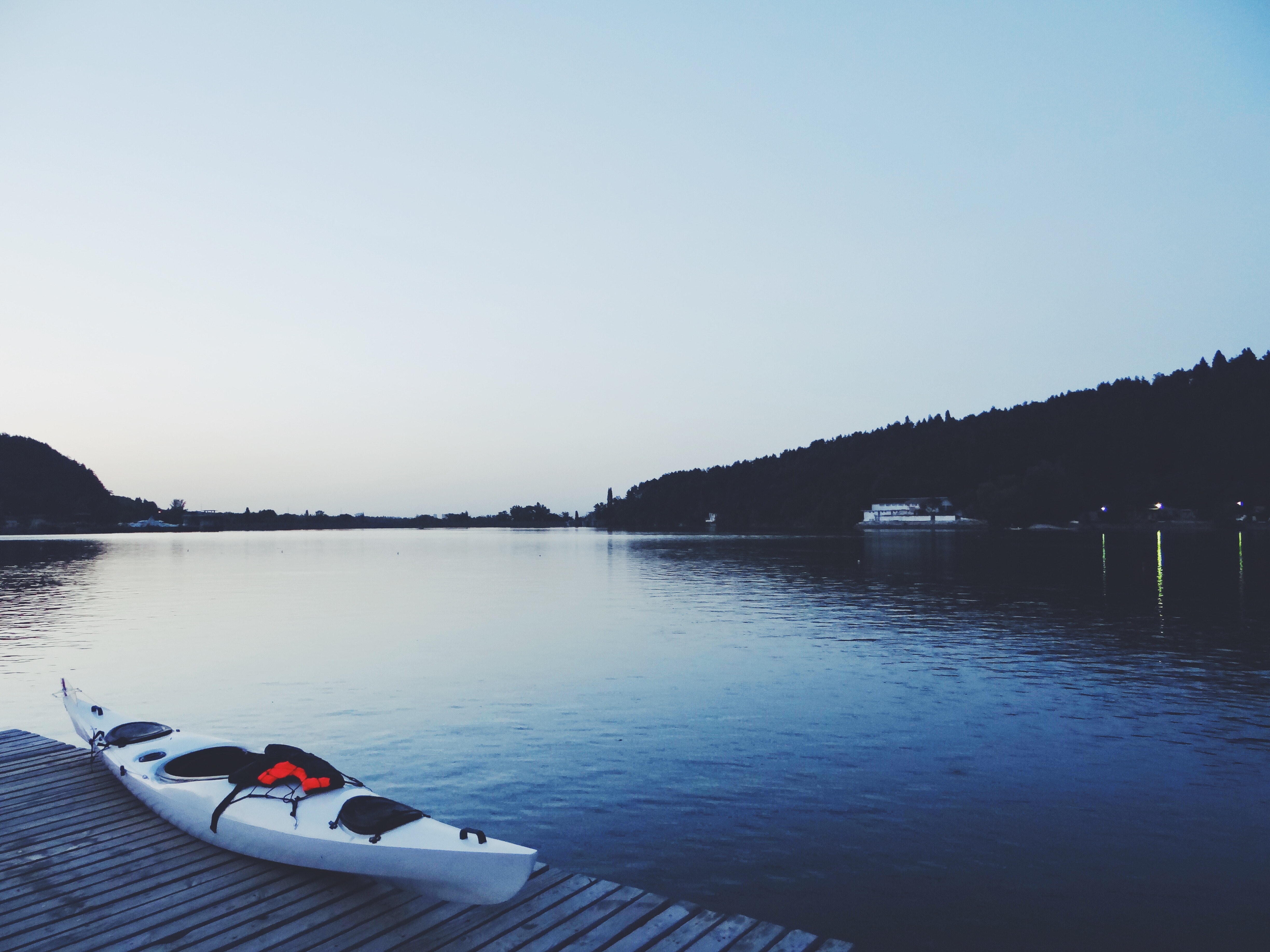 White Kayak on Brown Wooden Dock · Free Stock Photo