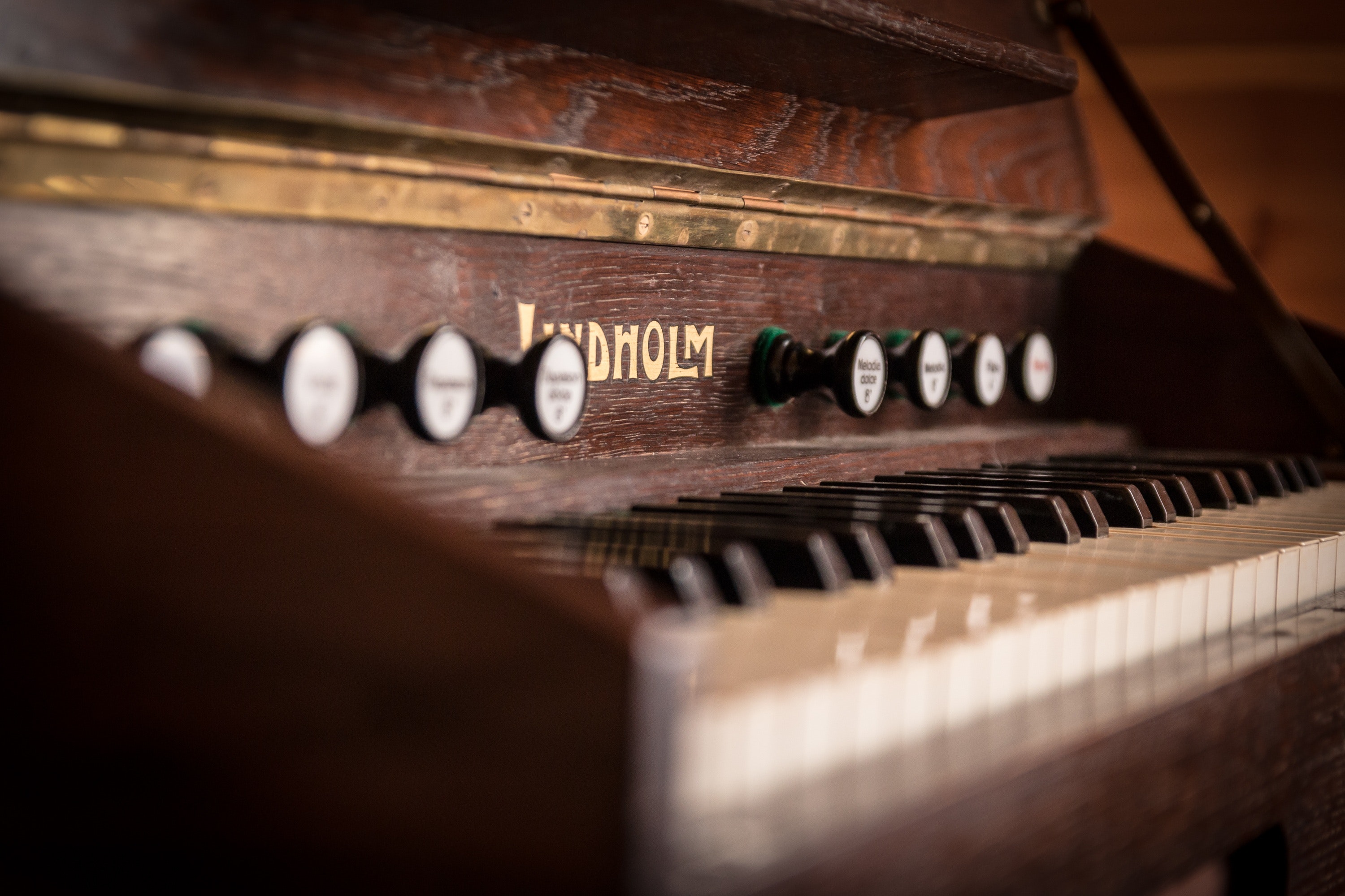 Brown wooden piano photo
