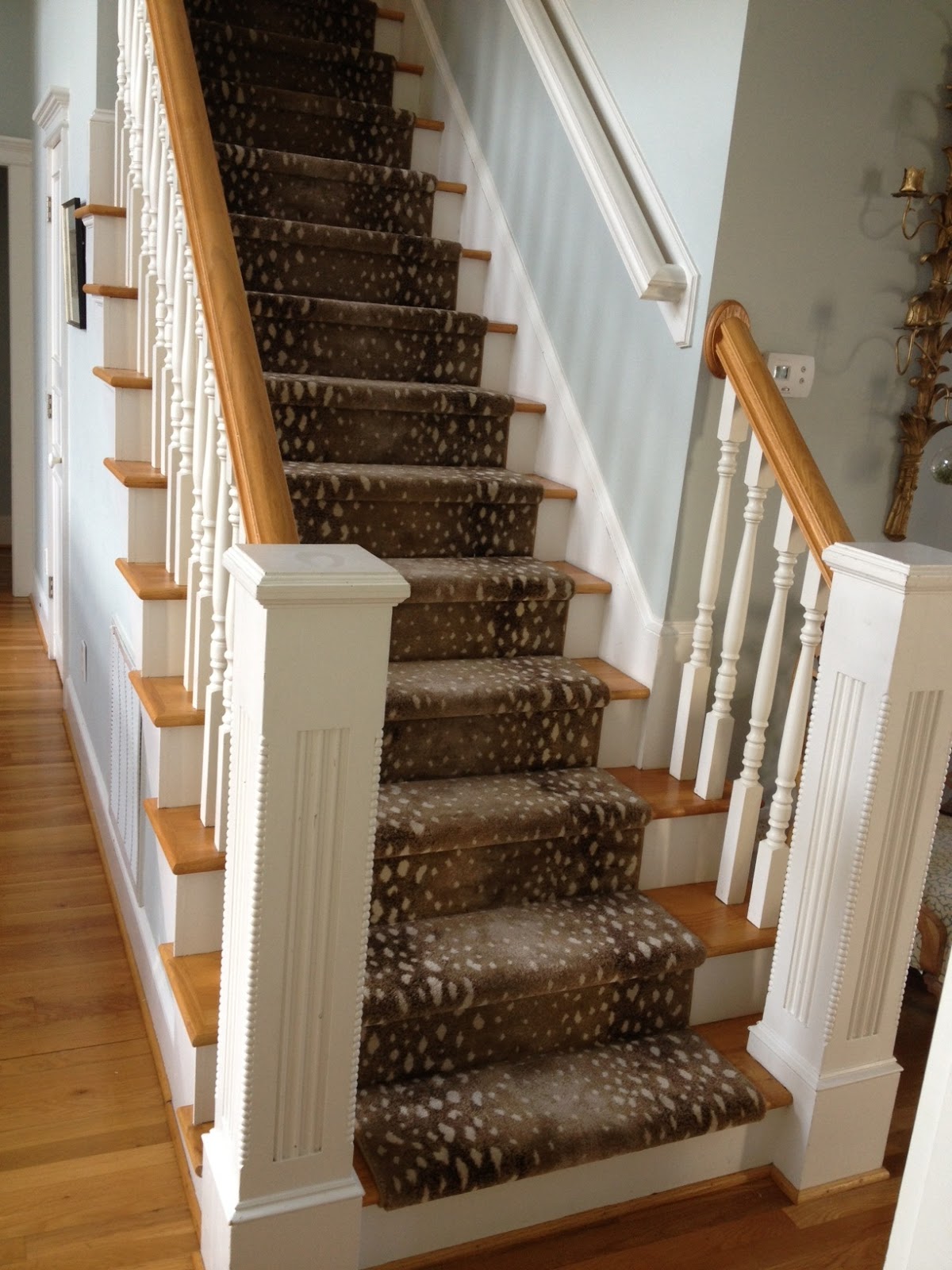 White Stained Wooden Stair With Light Brown Step And Deer Skin ...
