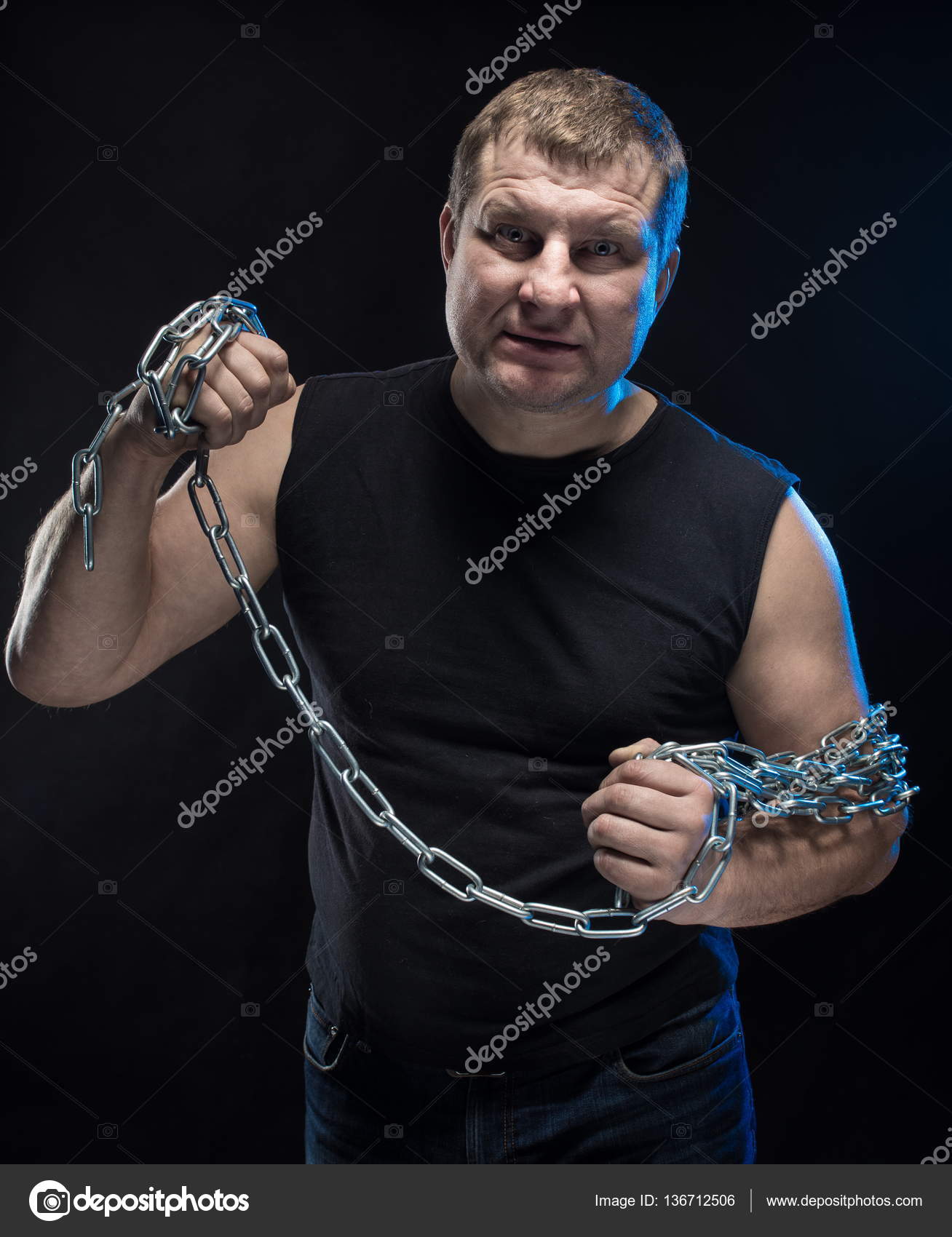 Actor Brutal man with a chain in his hands — Stock Photo © Kozlik ...