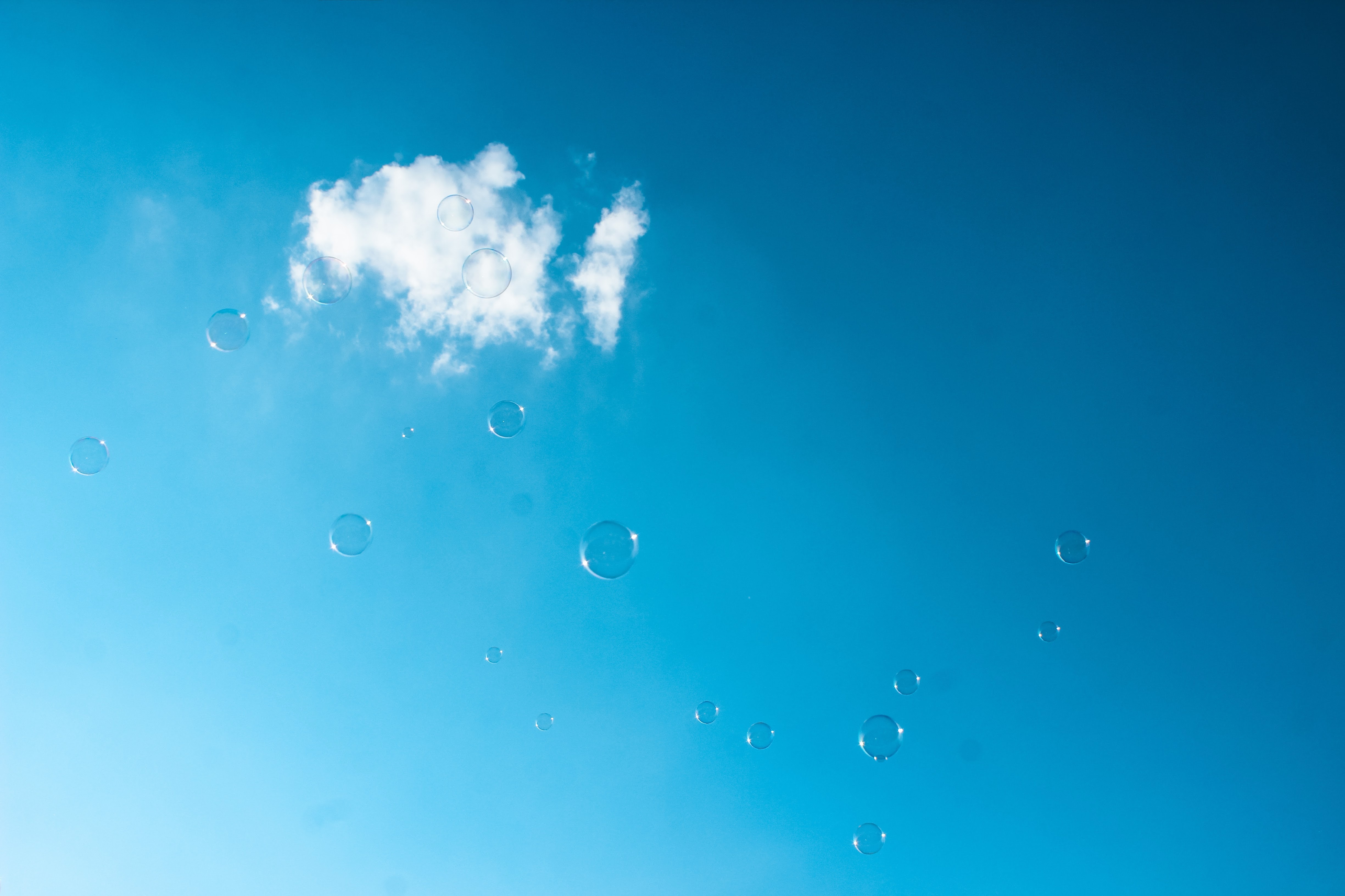 Bubbles under white clouds photo