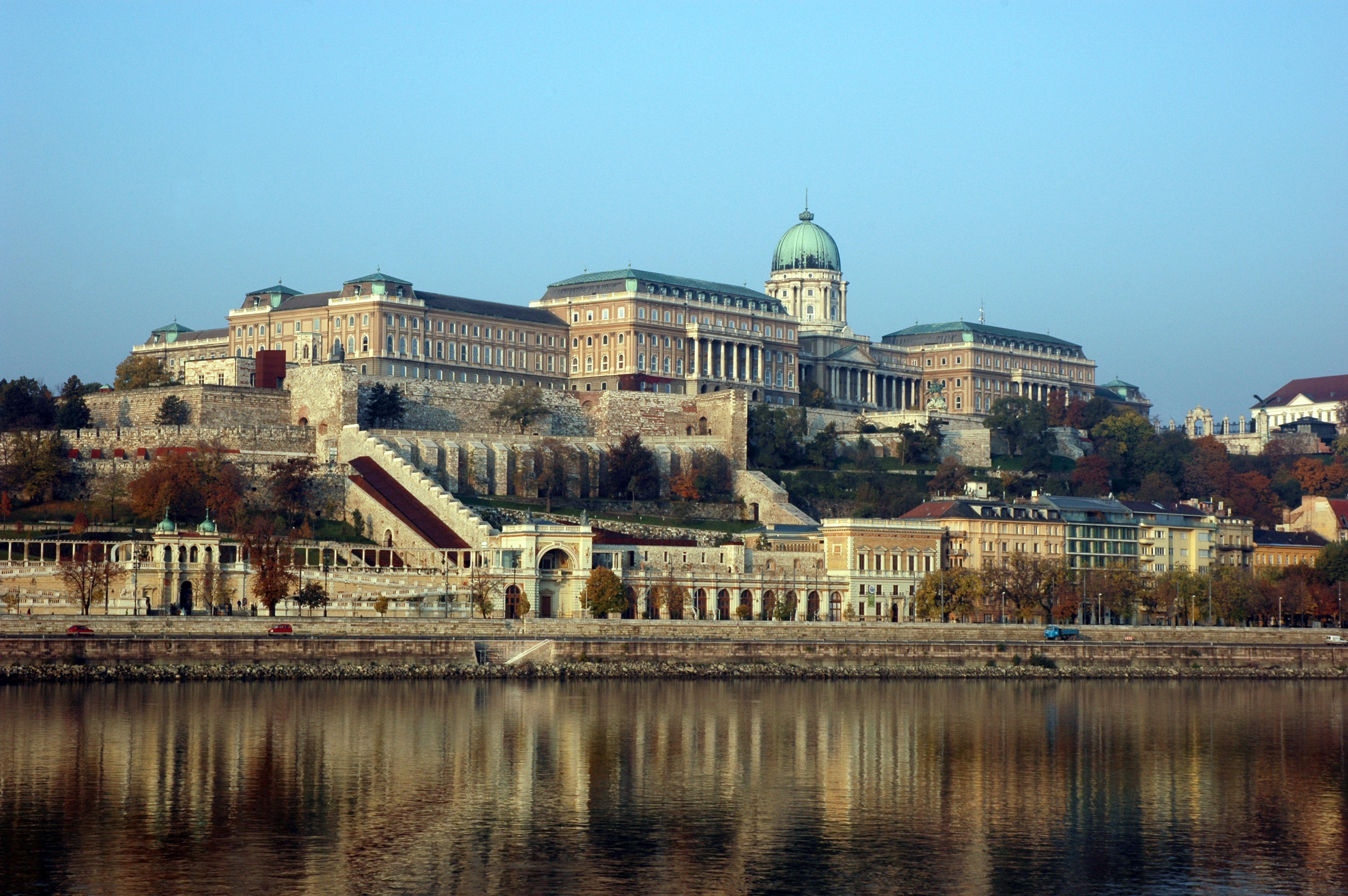 Buda castle near body of water under blue sky during daytime photo