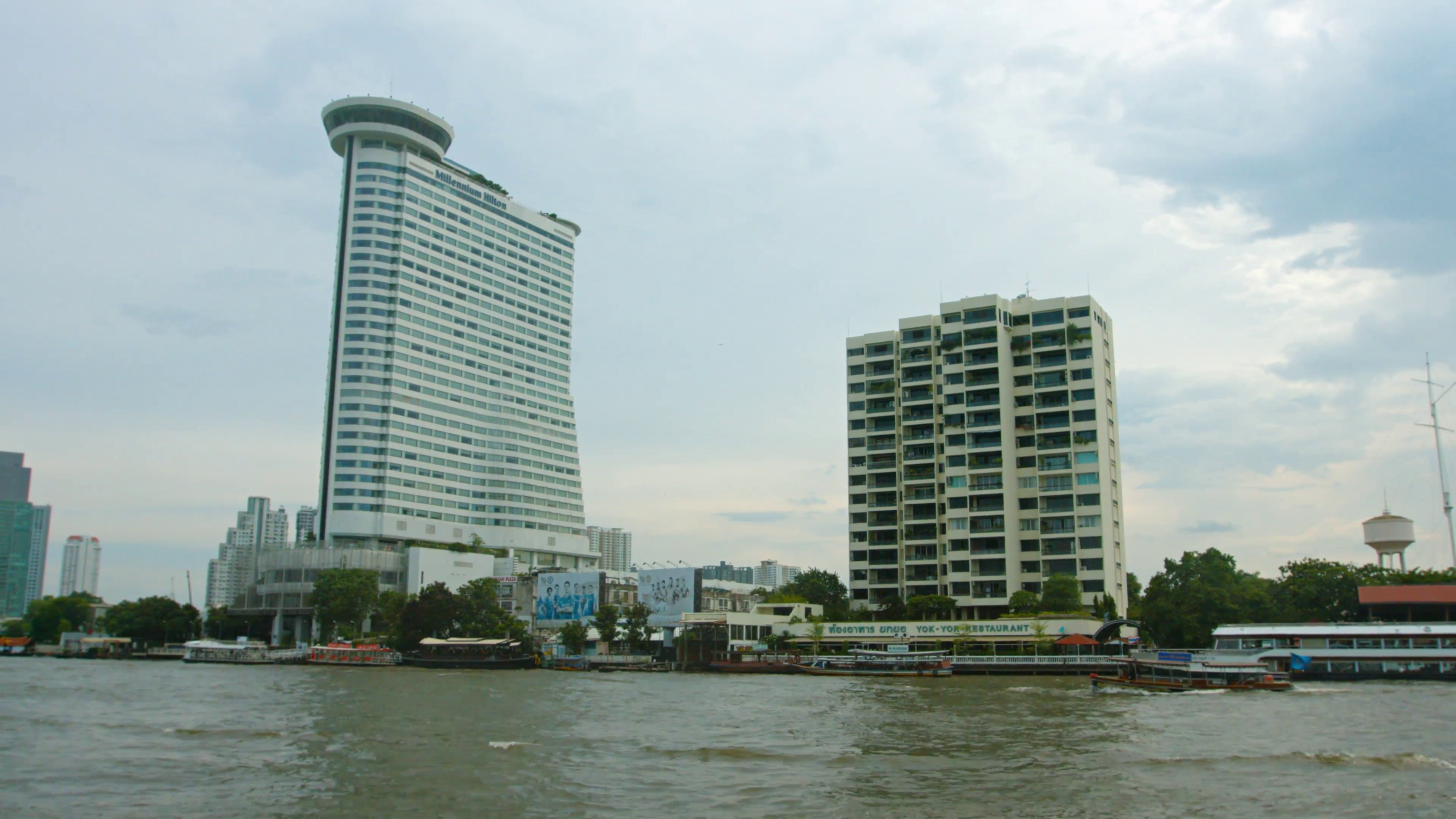 Millennium Hilton building on Chao Phraya River bank. 4k video Stock ...