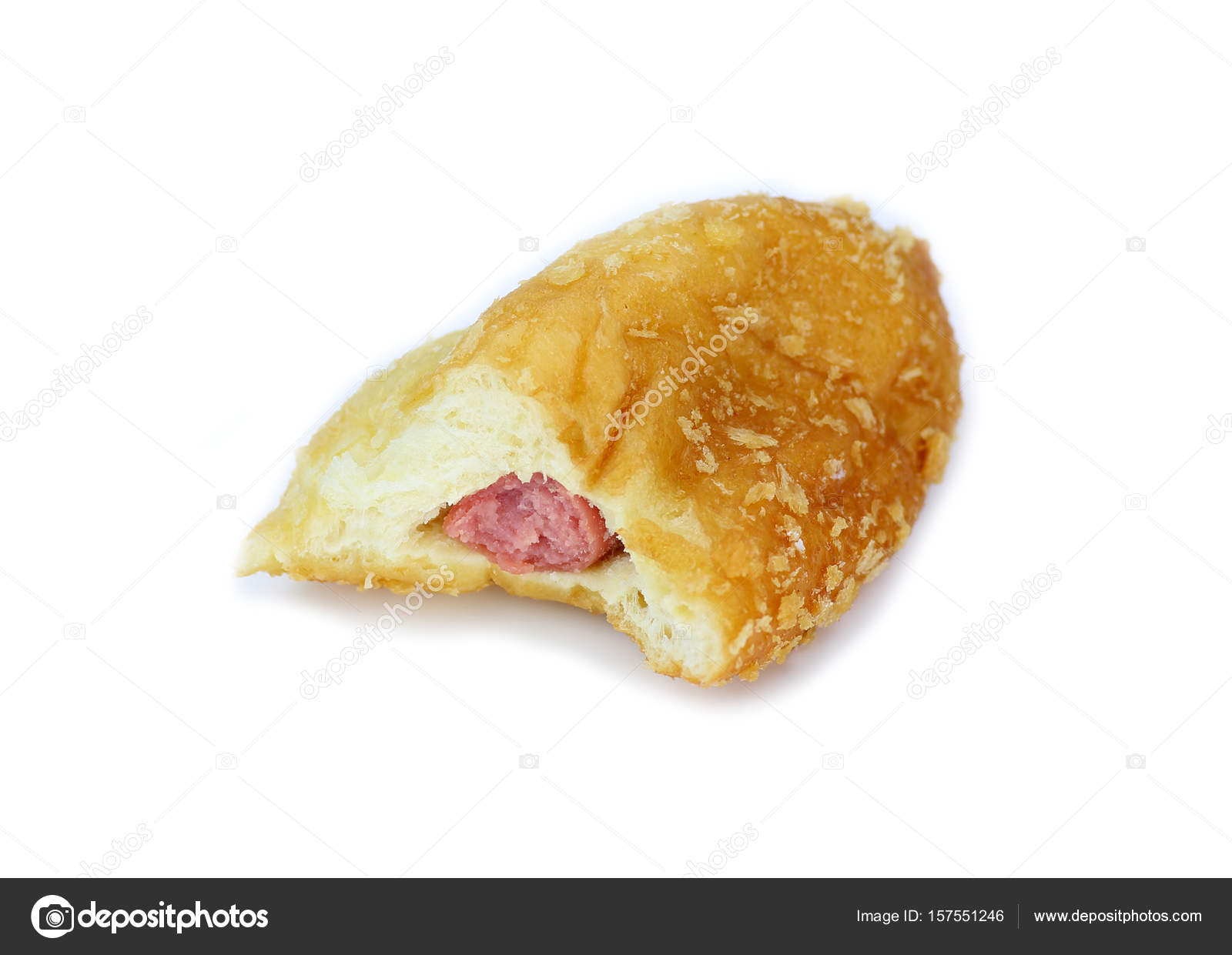 bite baked bun with sausage inside isolated on white background ...