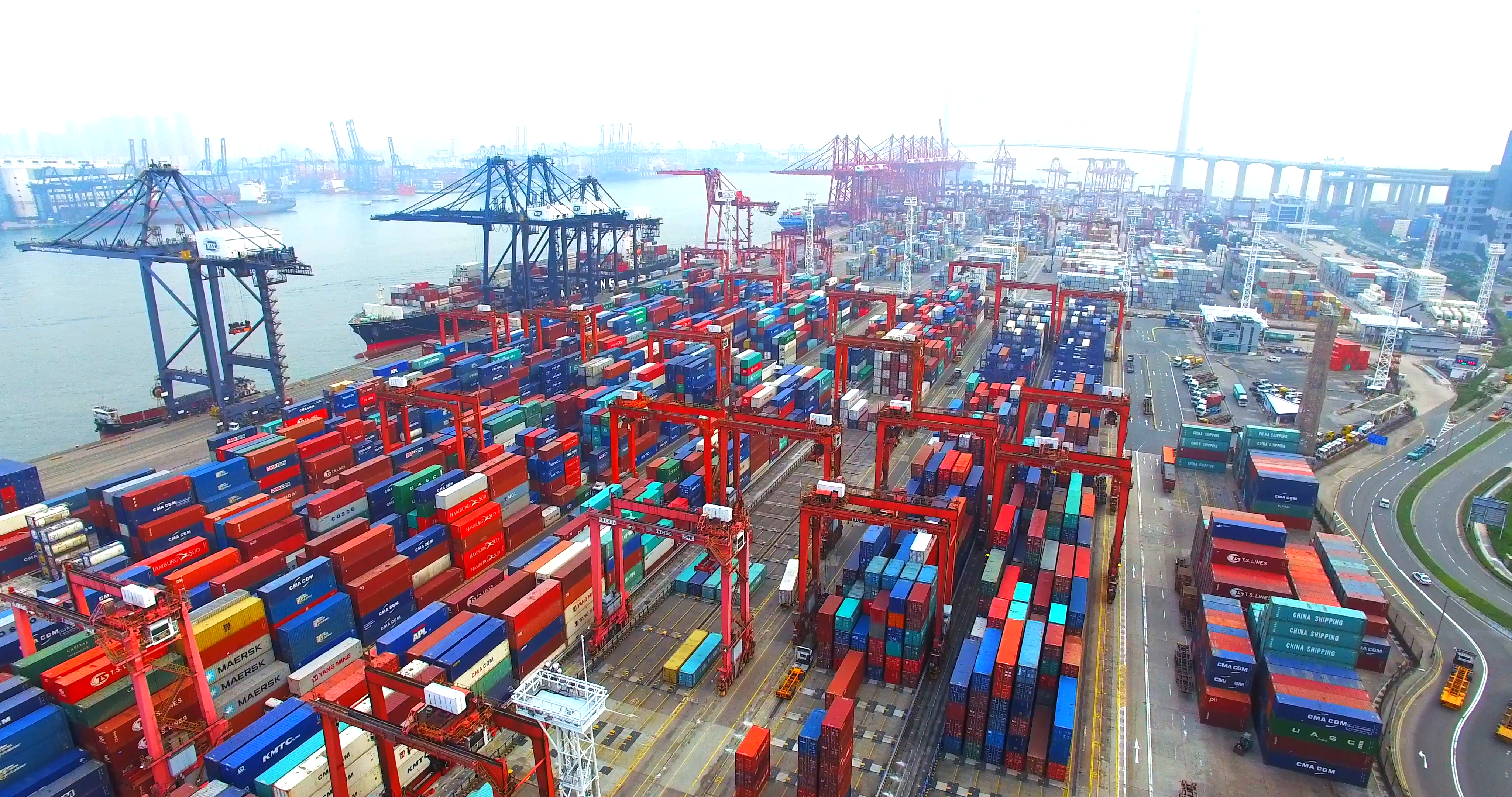 Flying high above a lot of cargo containers in port of Hong Kong and ...