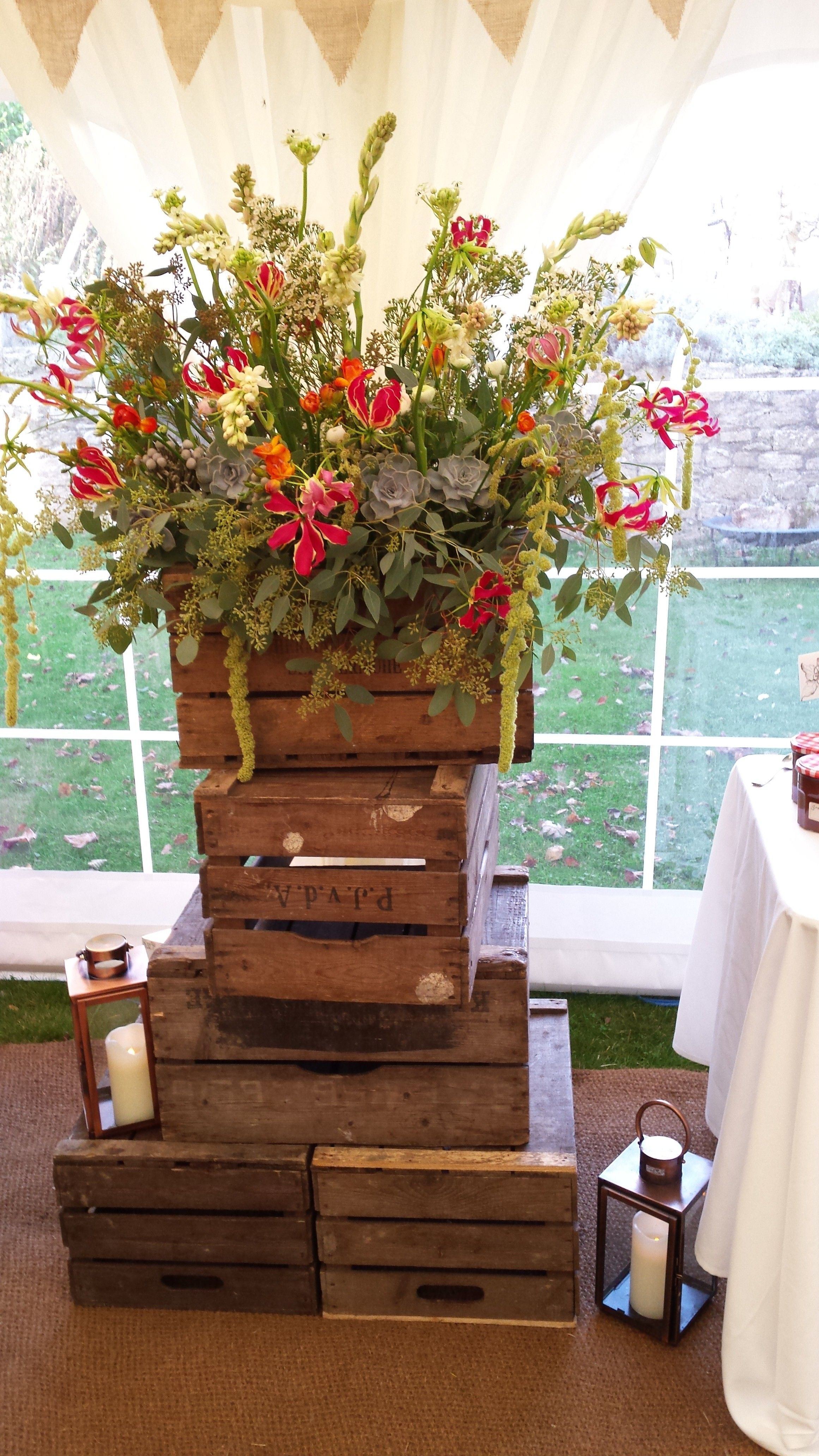 Wooden crate stacks with Wilde Bunch copper lanterns. A beautiful ...