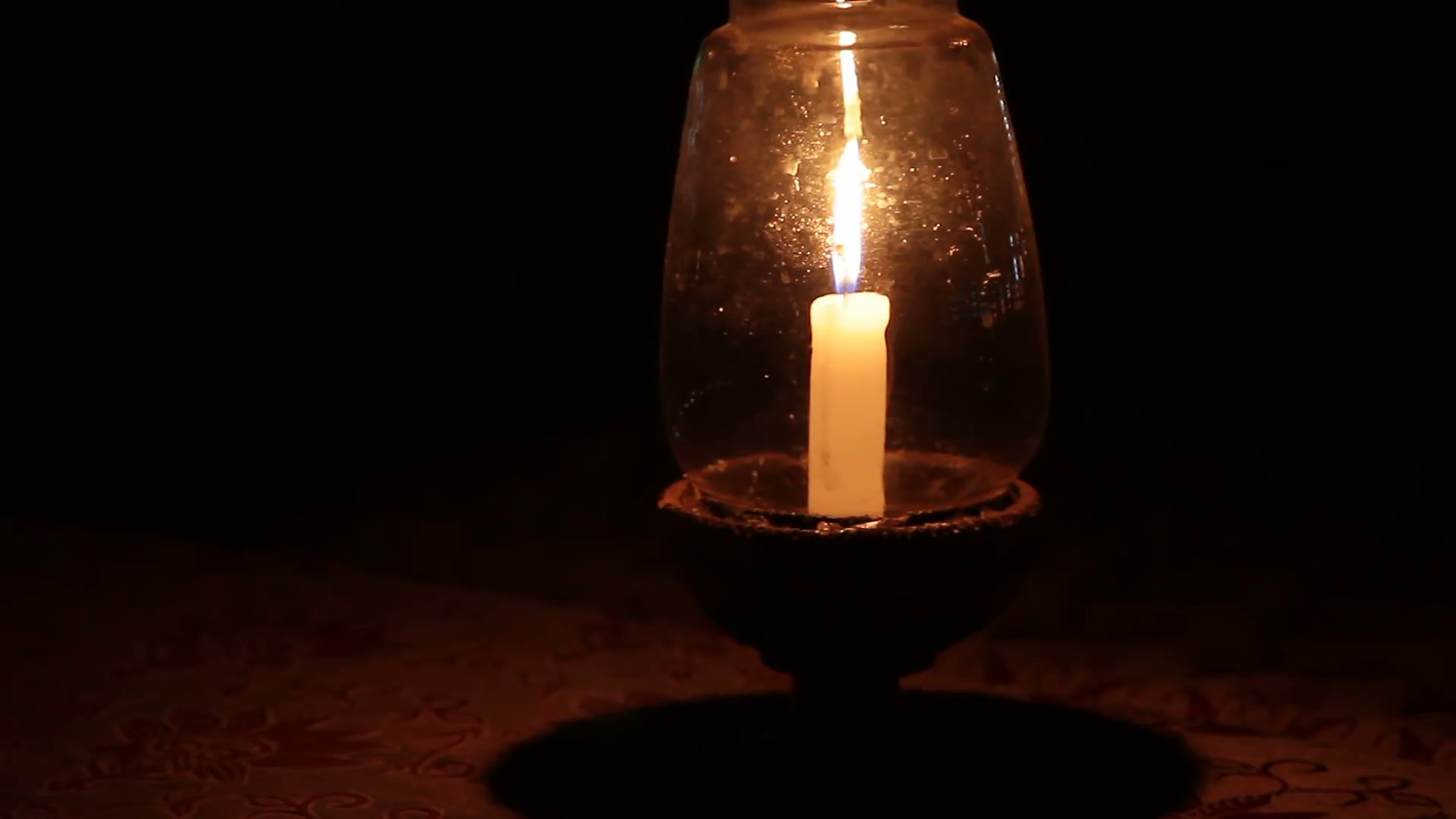 Bright burning candle in the dark Stock Video Footage - Videoblocks