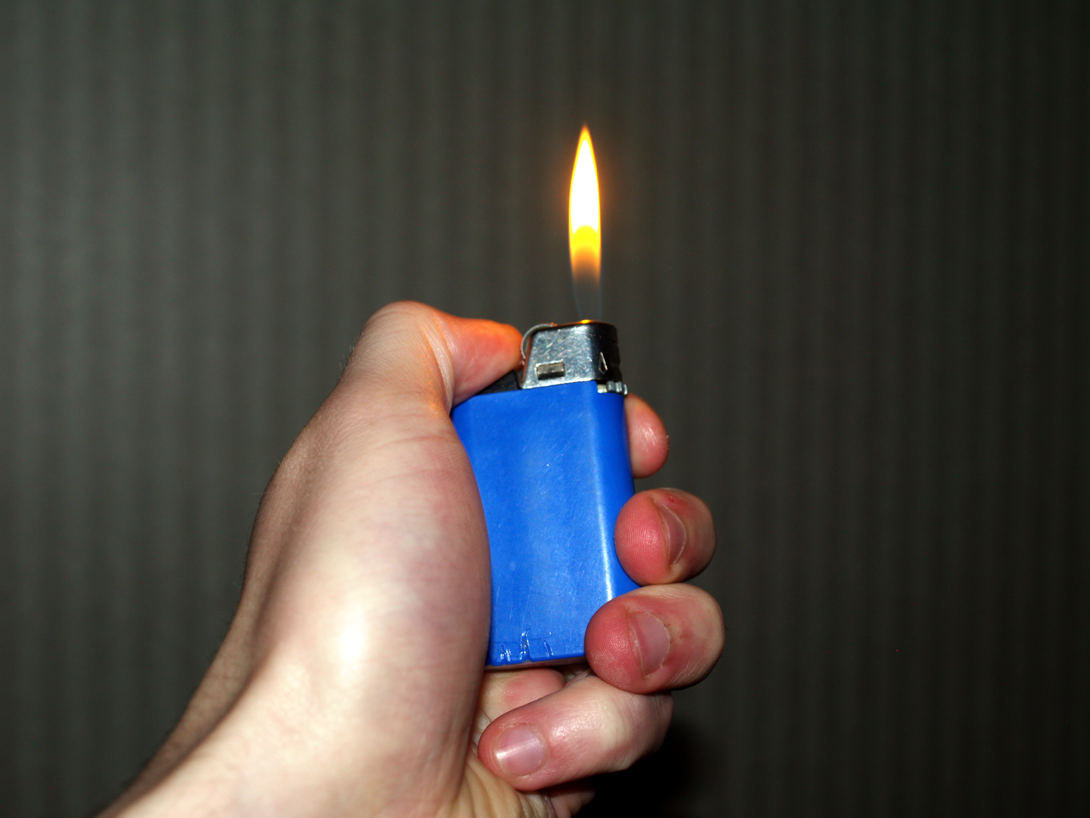 File:Hand holding burning lighter.jpg - Wikimedia Commons
