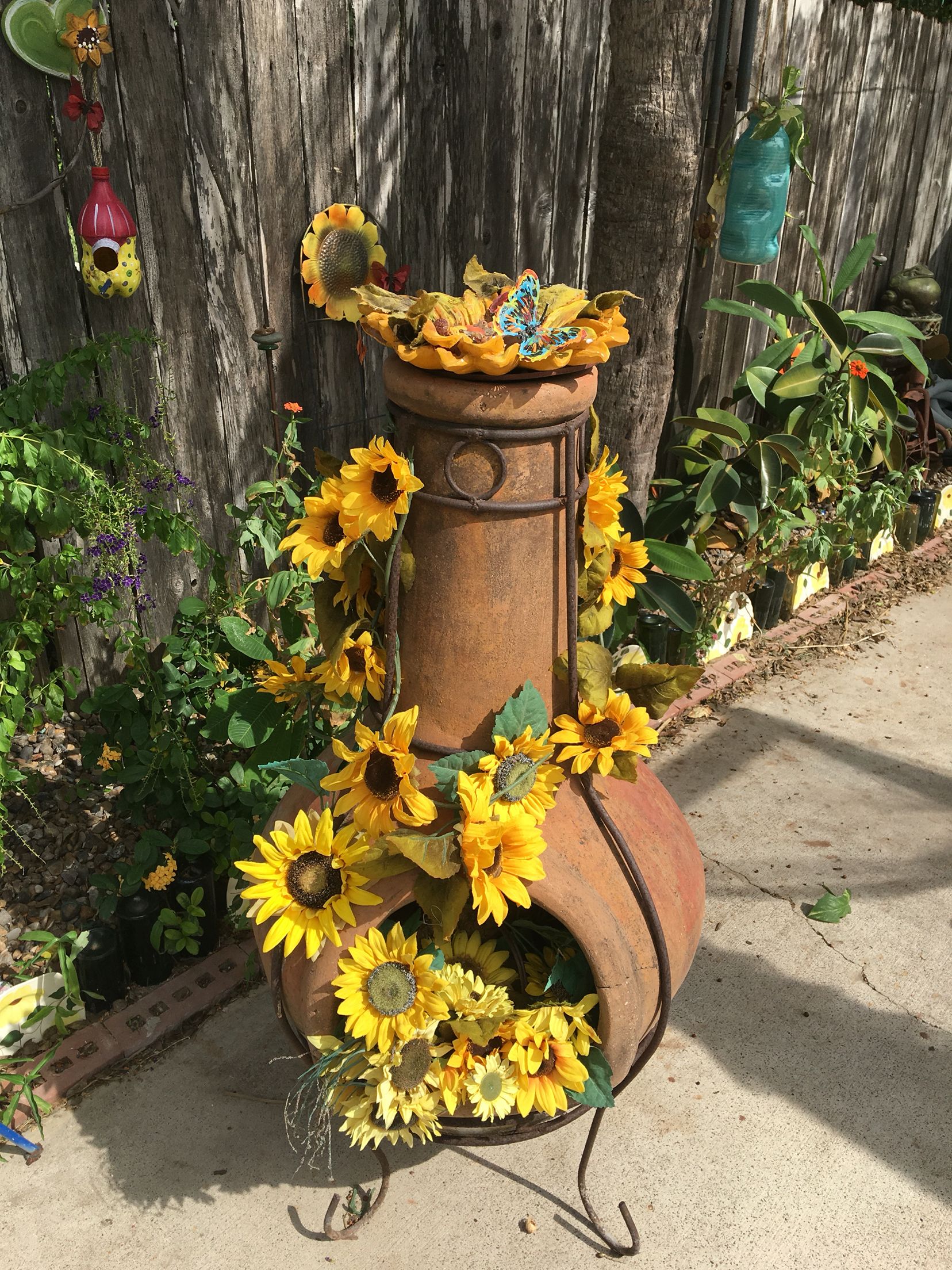 Sunflowers on outdoor Mexican burning log holder | OUTDOOR SWINGS ...