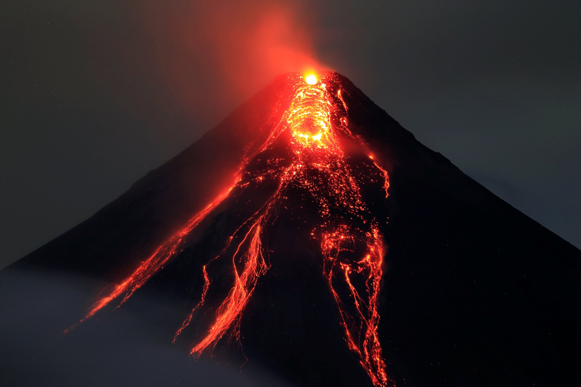 Geologists take burning-hot lava samples from active volcanoes ...