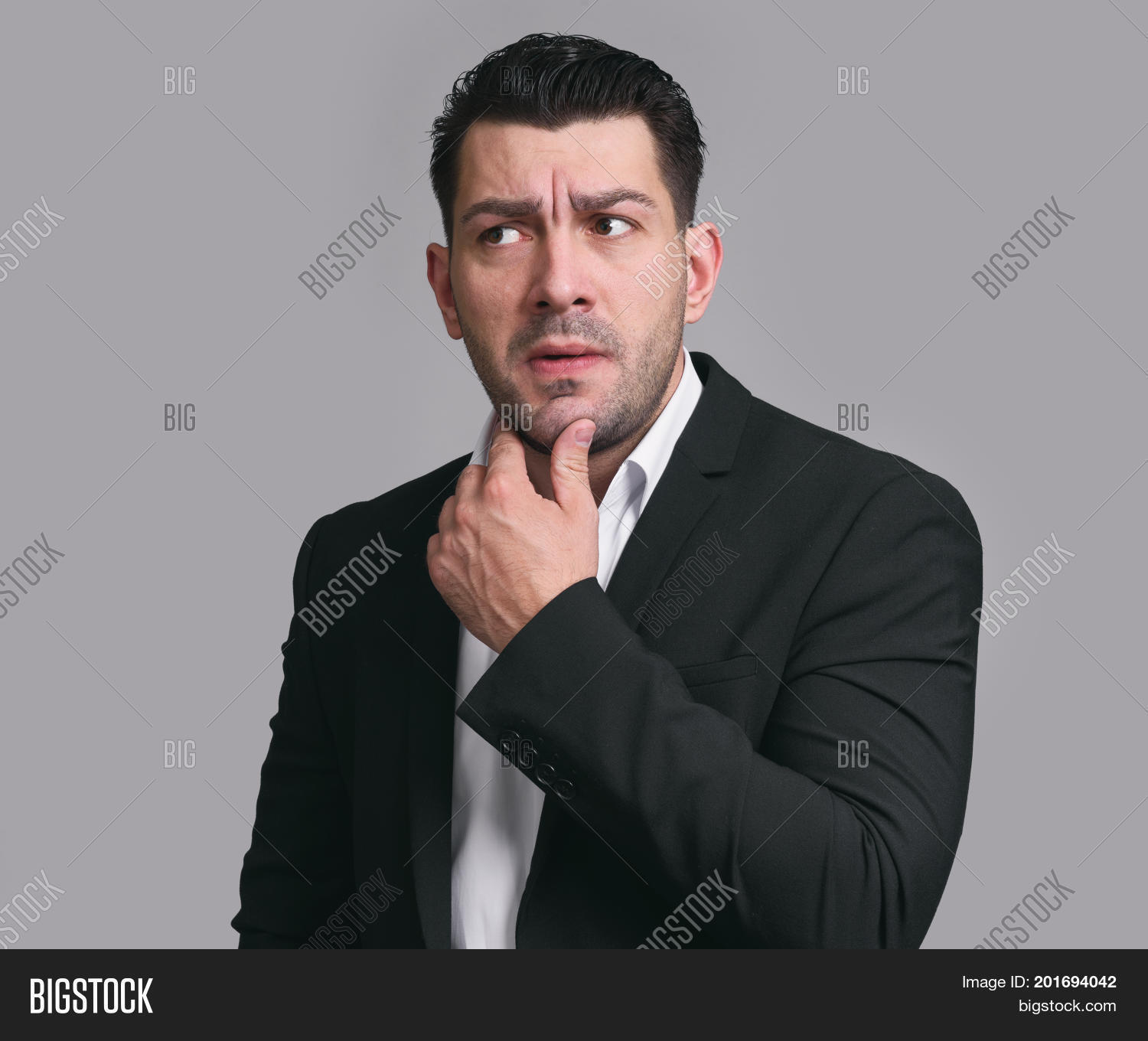 Confused Businessman Thinking about Problem Image - cg2p01694042c